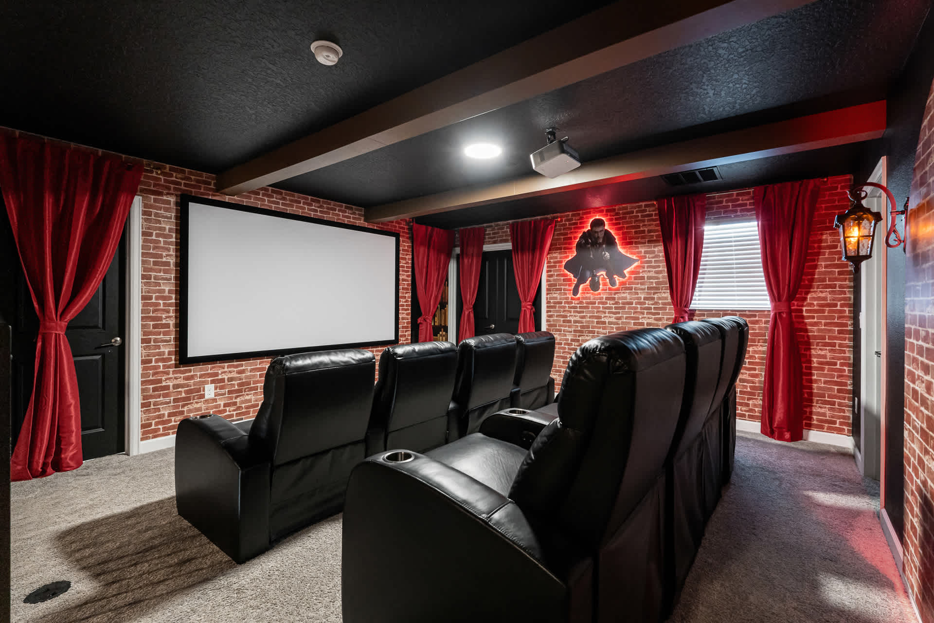Harry Potter Themed Movie Room with Large Projector Screen and Cinematic Seating