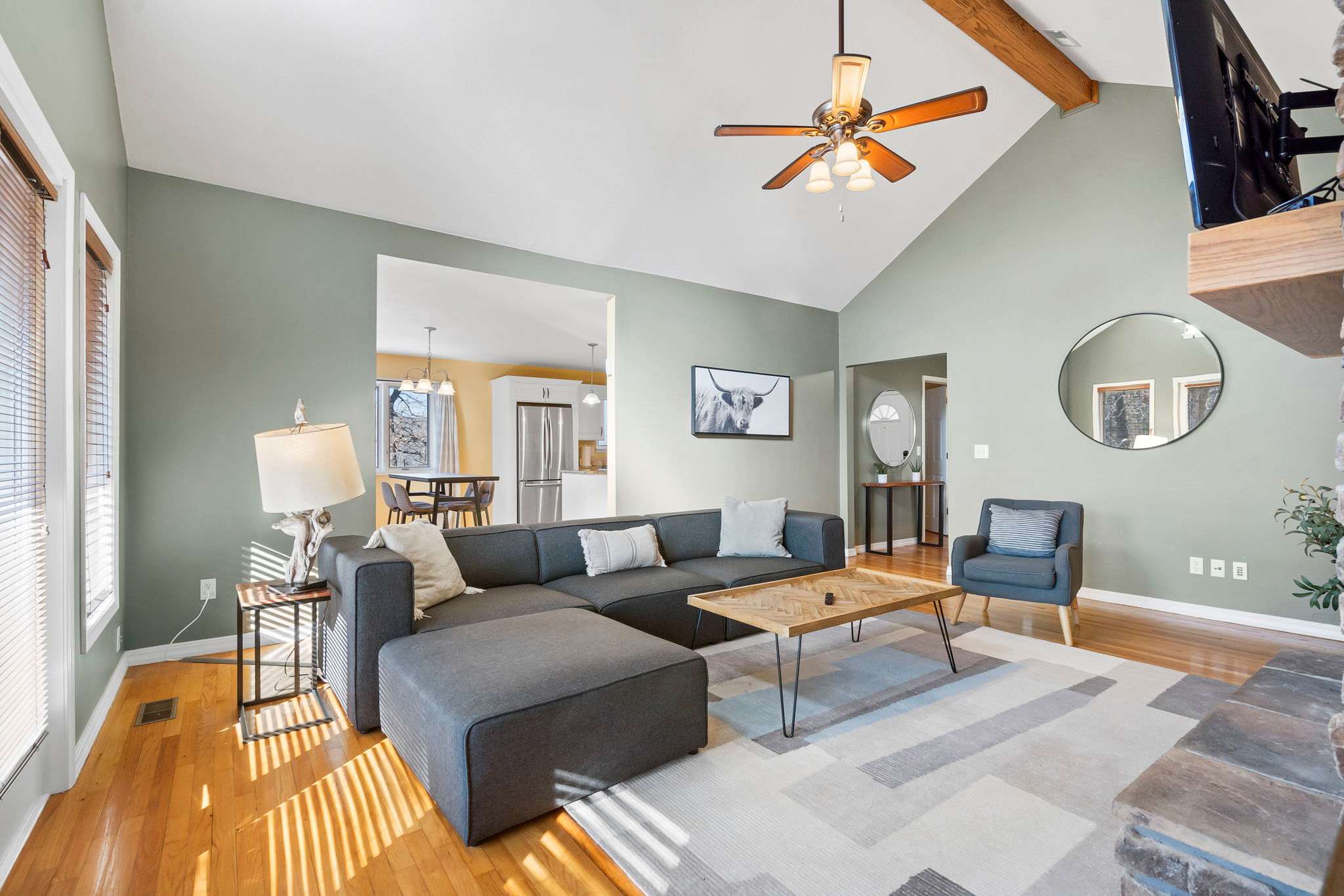 Large living area with comfortable couch and smart TV