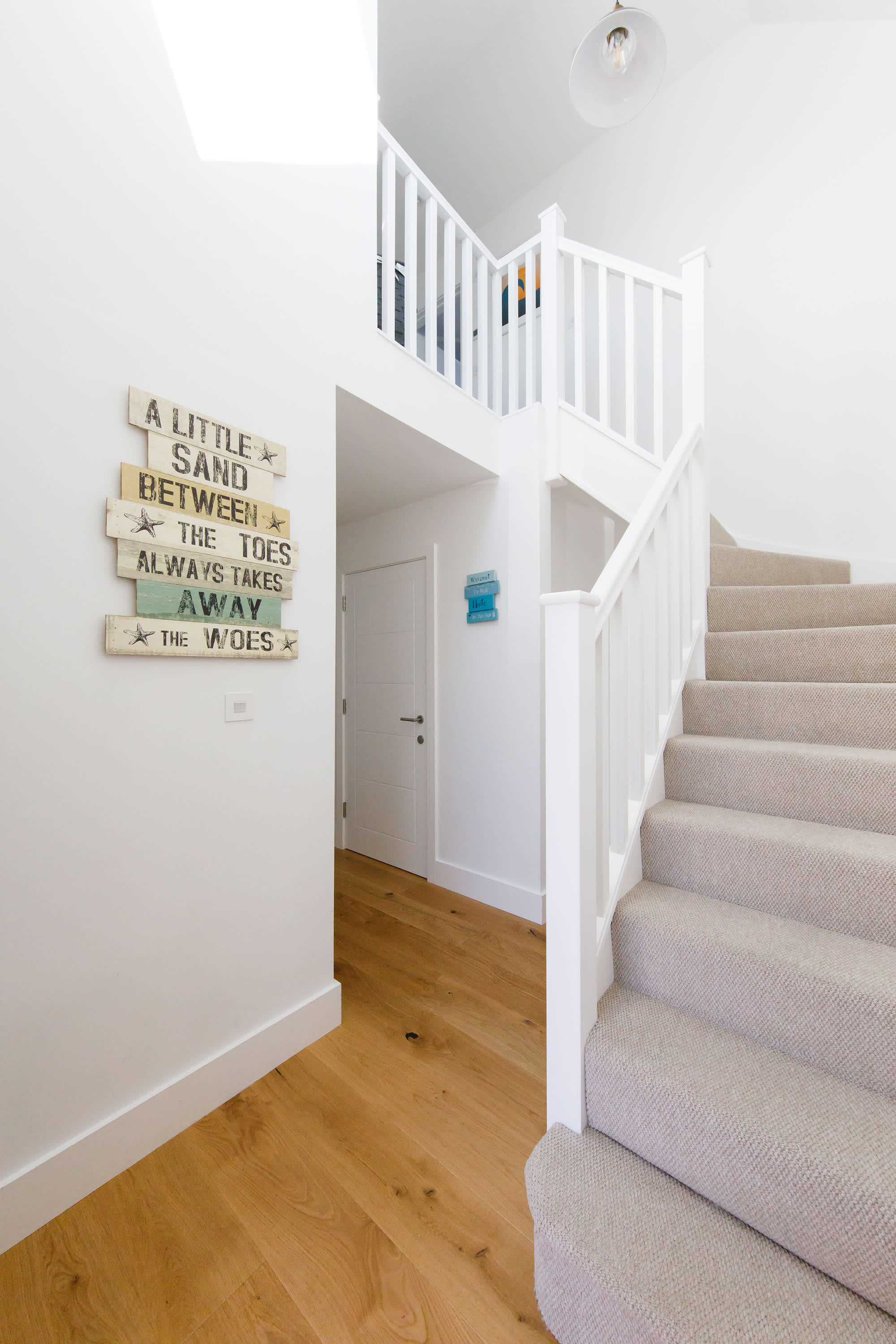Elegant wooden floor spread across the ground floor, while the staircase and the first floor feature cosy carpeted flooring
