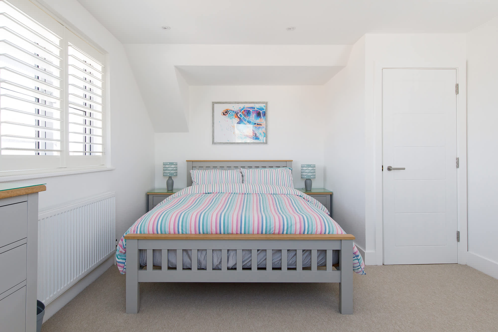 Bright, stylish, and comfy king bedroom!