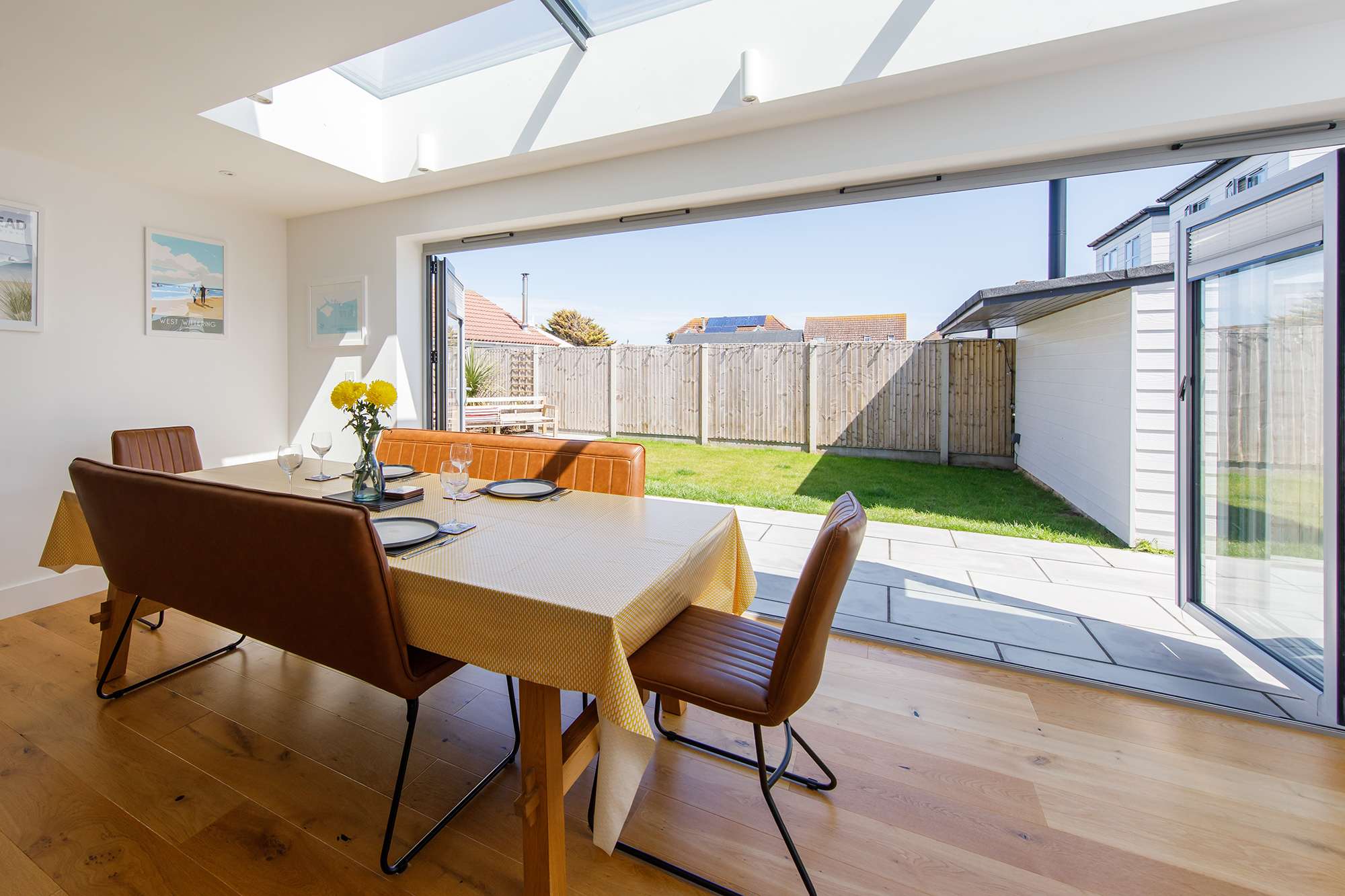The dining space looks out over the garden. Open up the patio doors on warmer days.