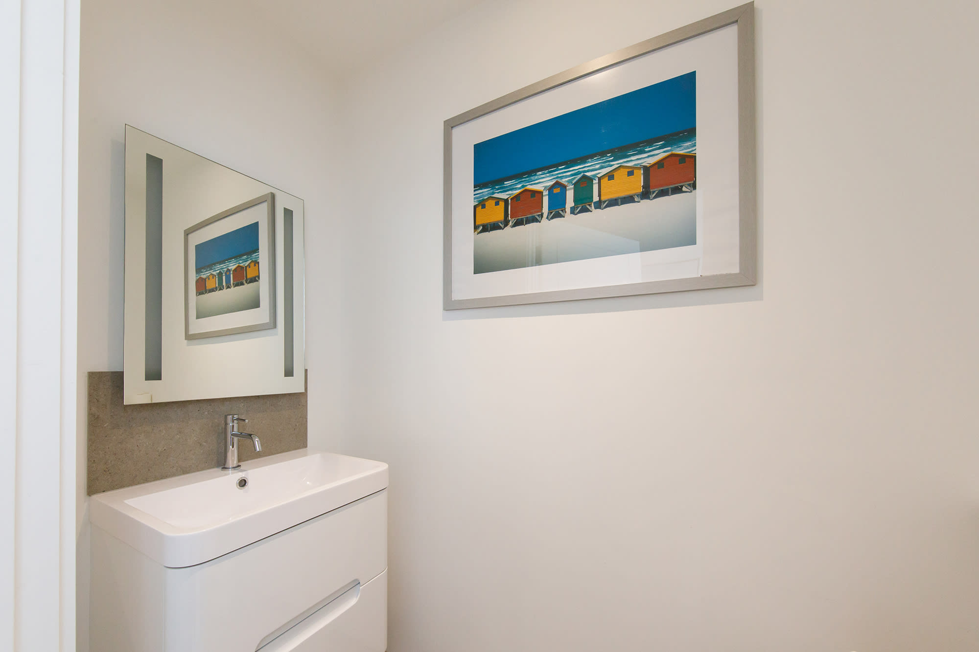 Ground floor bathroom: sink with overhead mirror