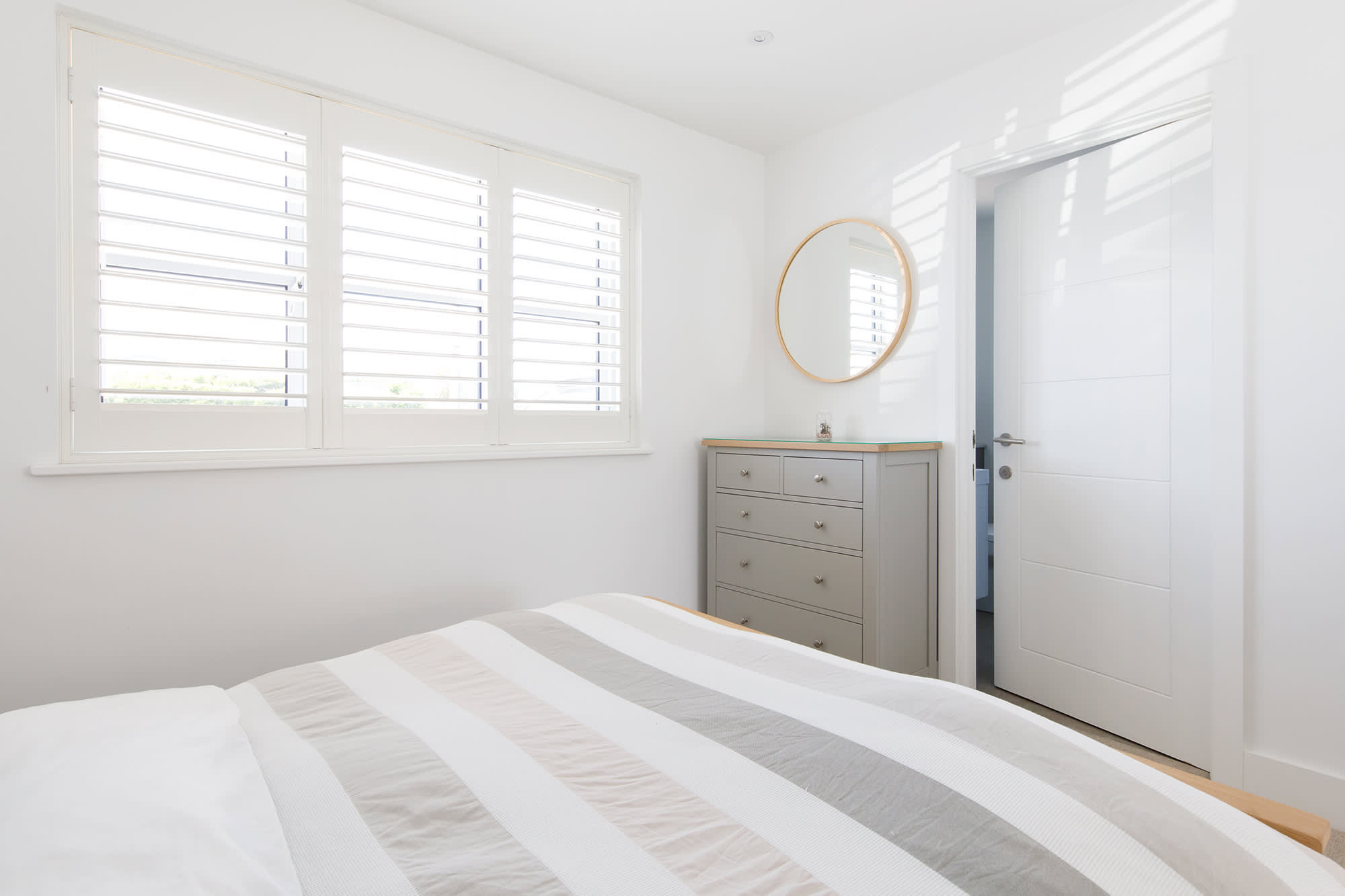 Open or close the shutters to let natural light flood in.