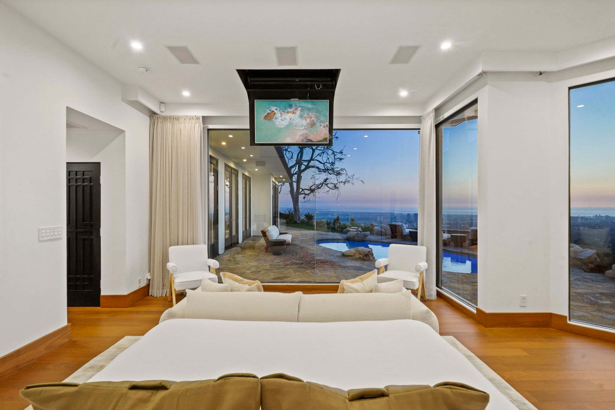 Floor-to-ceiling windows frame the breathtaking city views.