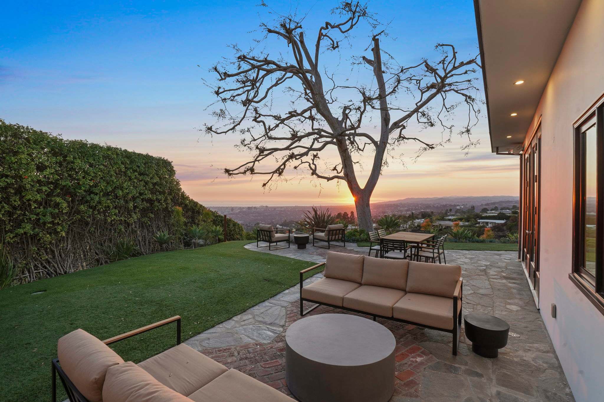 Cozy seating meets lush greenery for idyllic outdoor moments.
