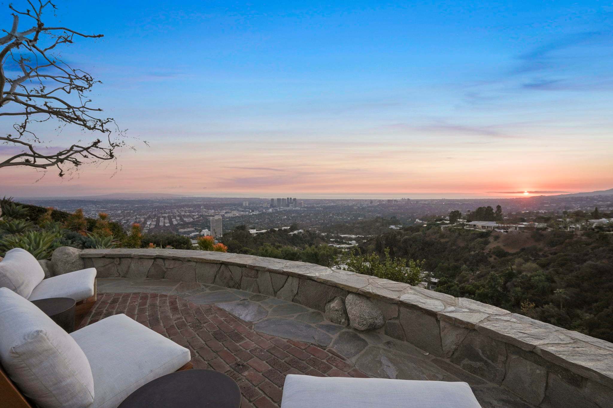 Relax in style overlooking the vibrant cityscape.
