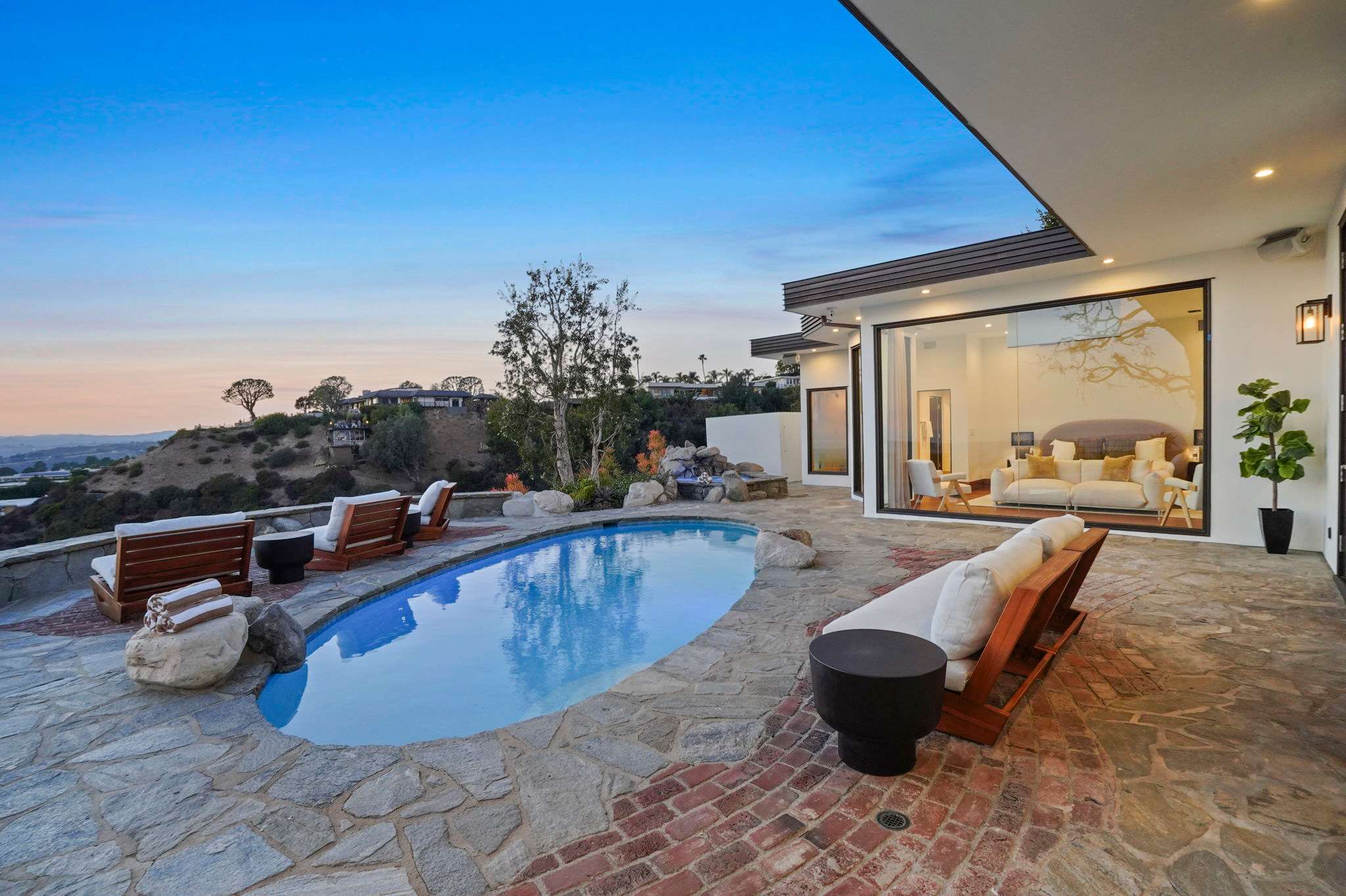 Catch the sunset from comfortable outdoor loungers.