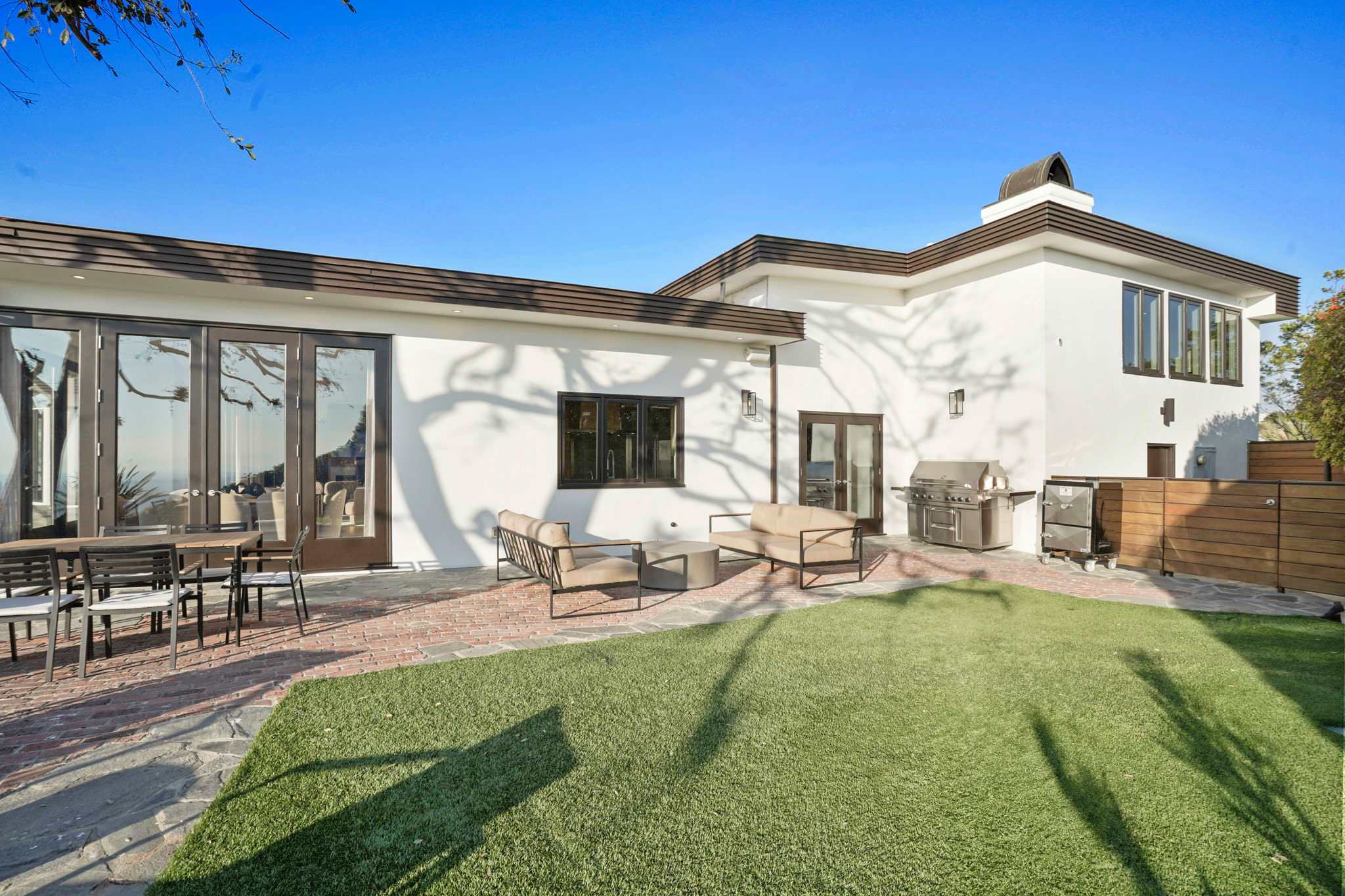 Gather around the BBQ in a space designed for unforgettable moments.