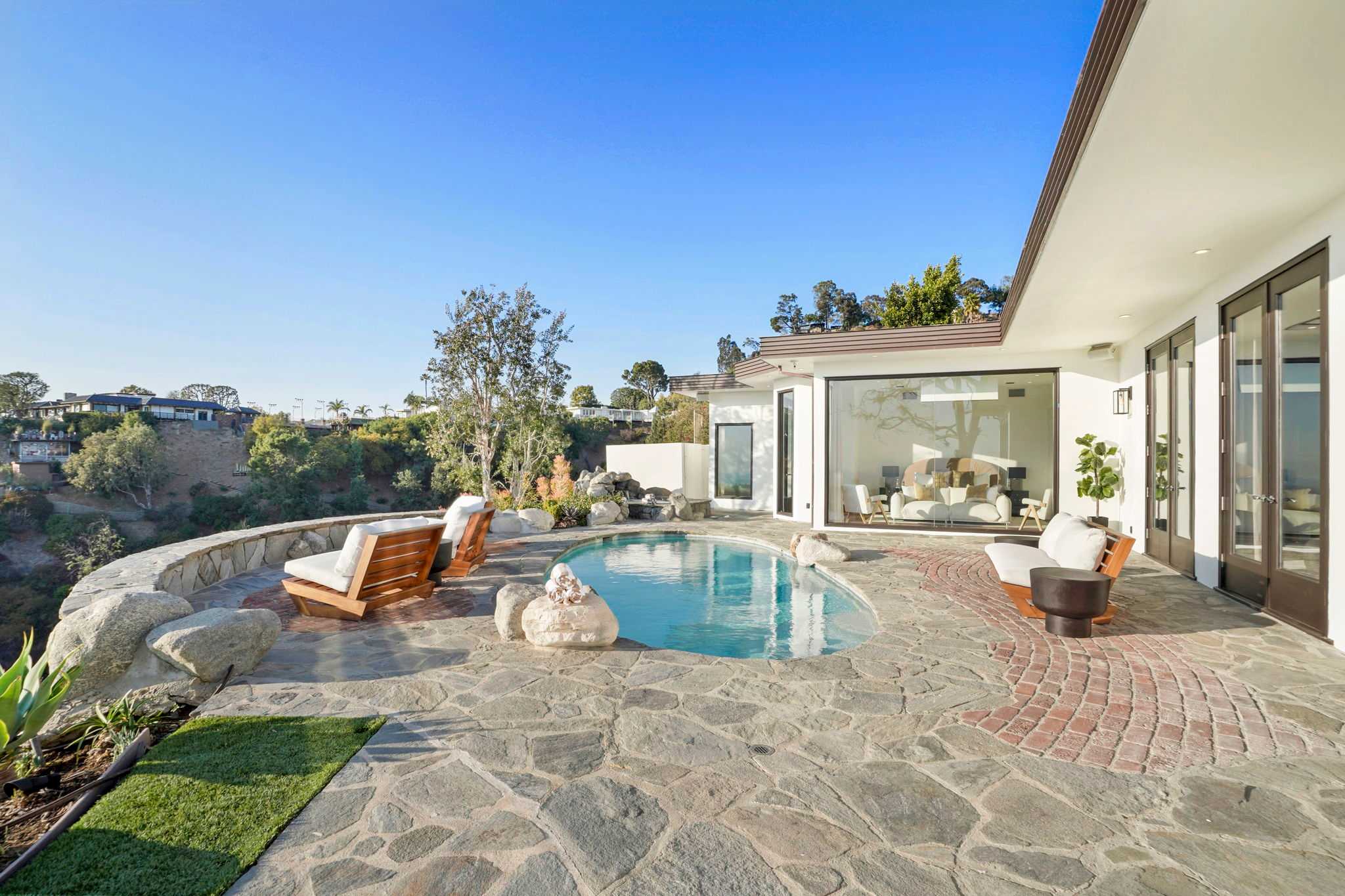Swim in the pool surrounded by natural beauty.