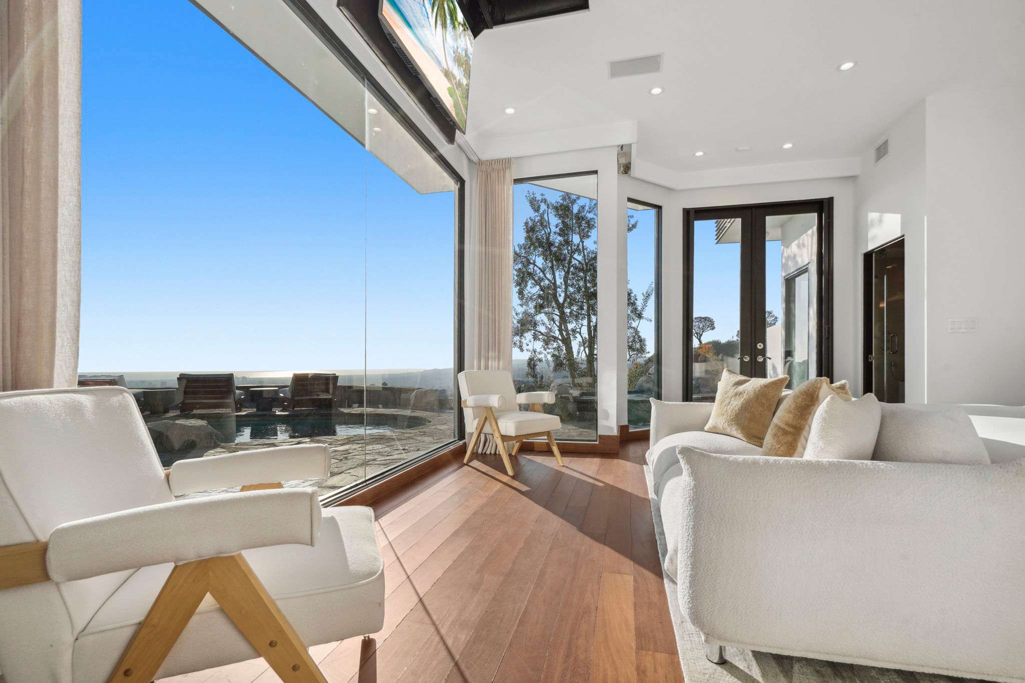 Glass walls invite the horizon into every moment of your stay.