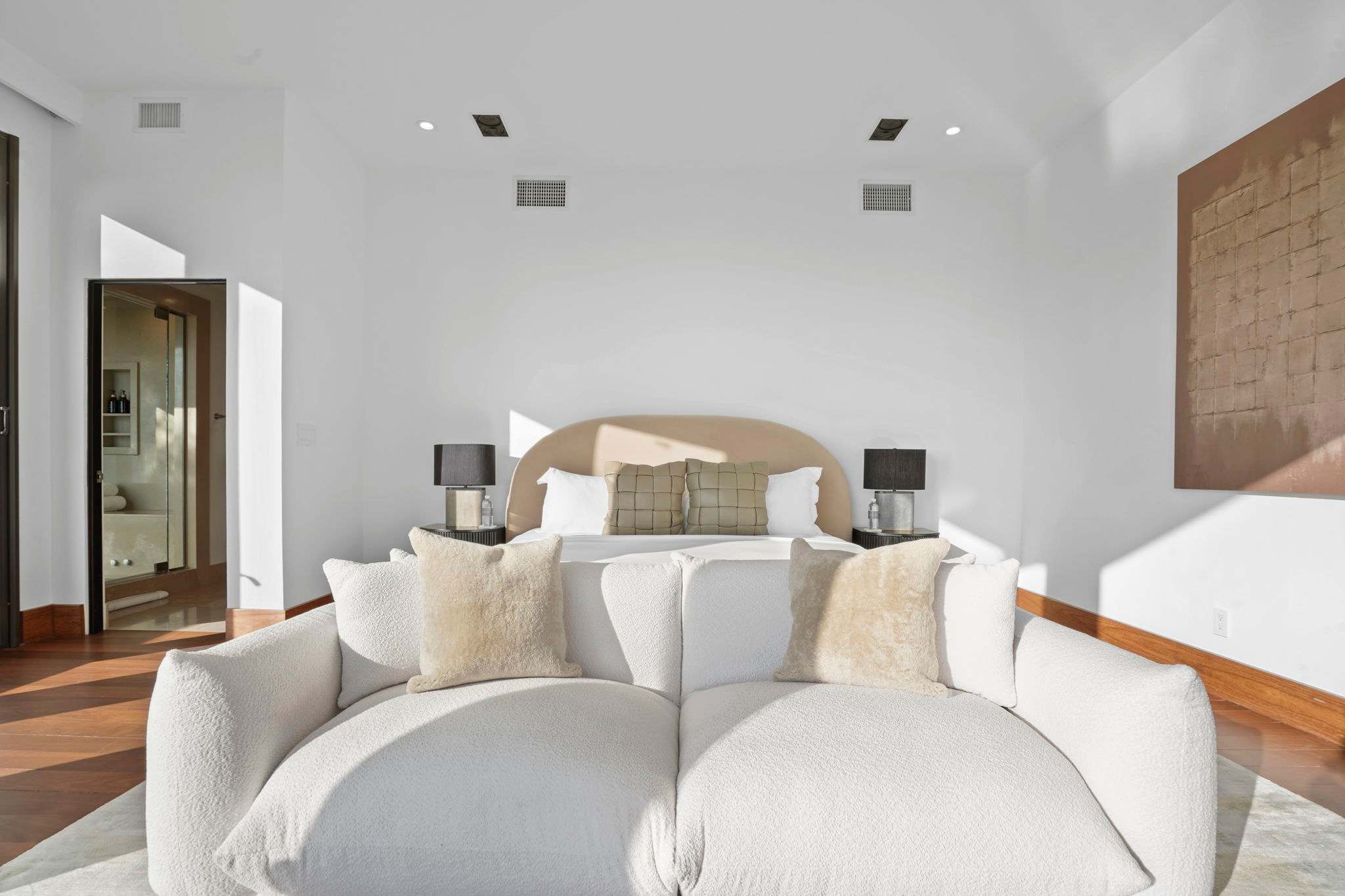 Curl up on the plush bouclé sofa and let the natural light soothe your senses.