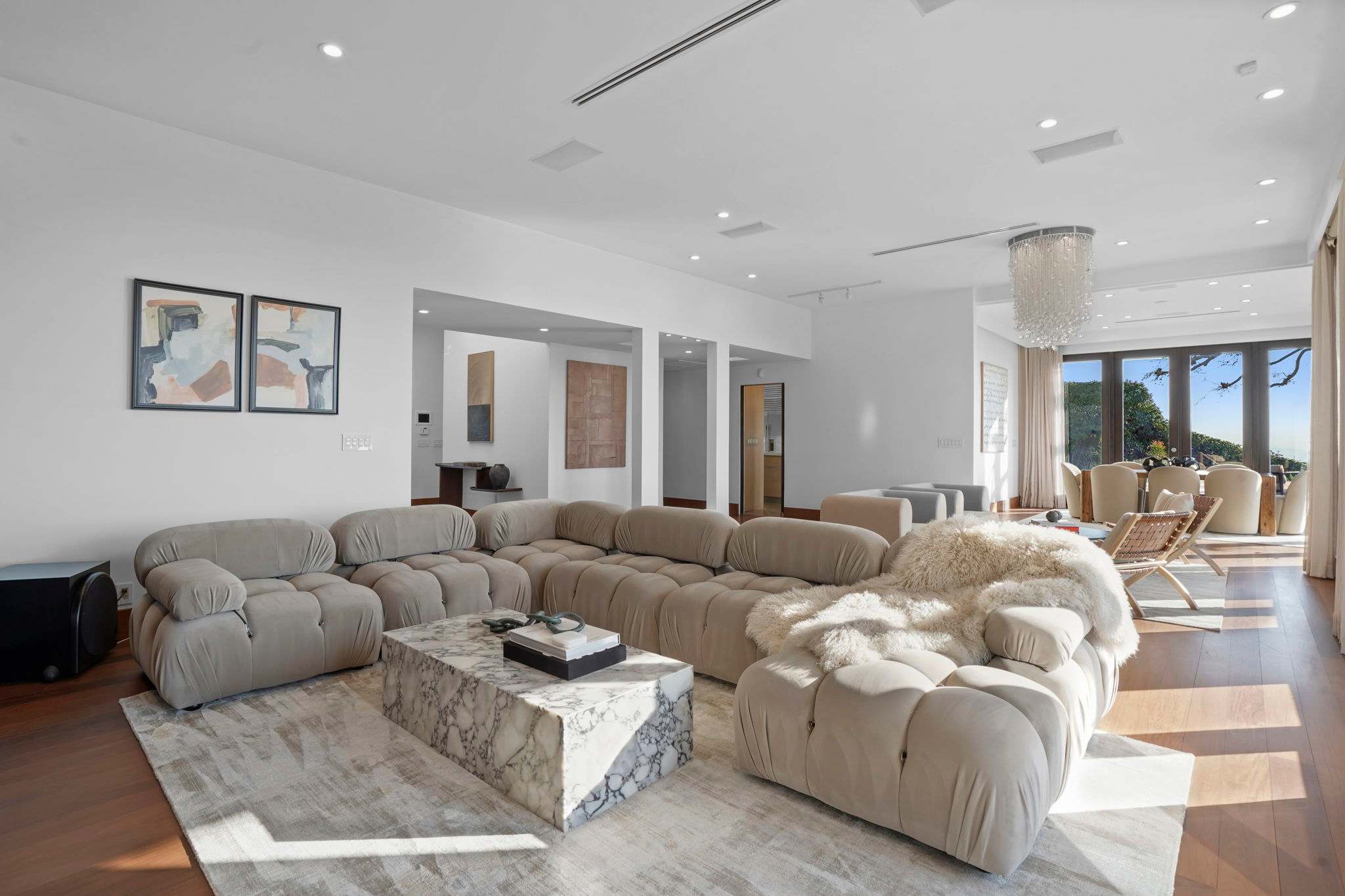 Relax on the plush, tufted modular sofa, perfect for unwinding.