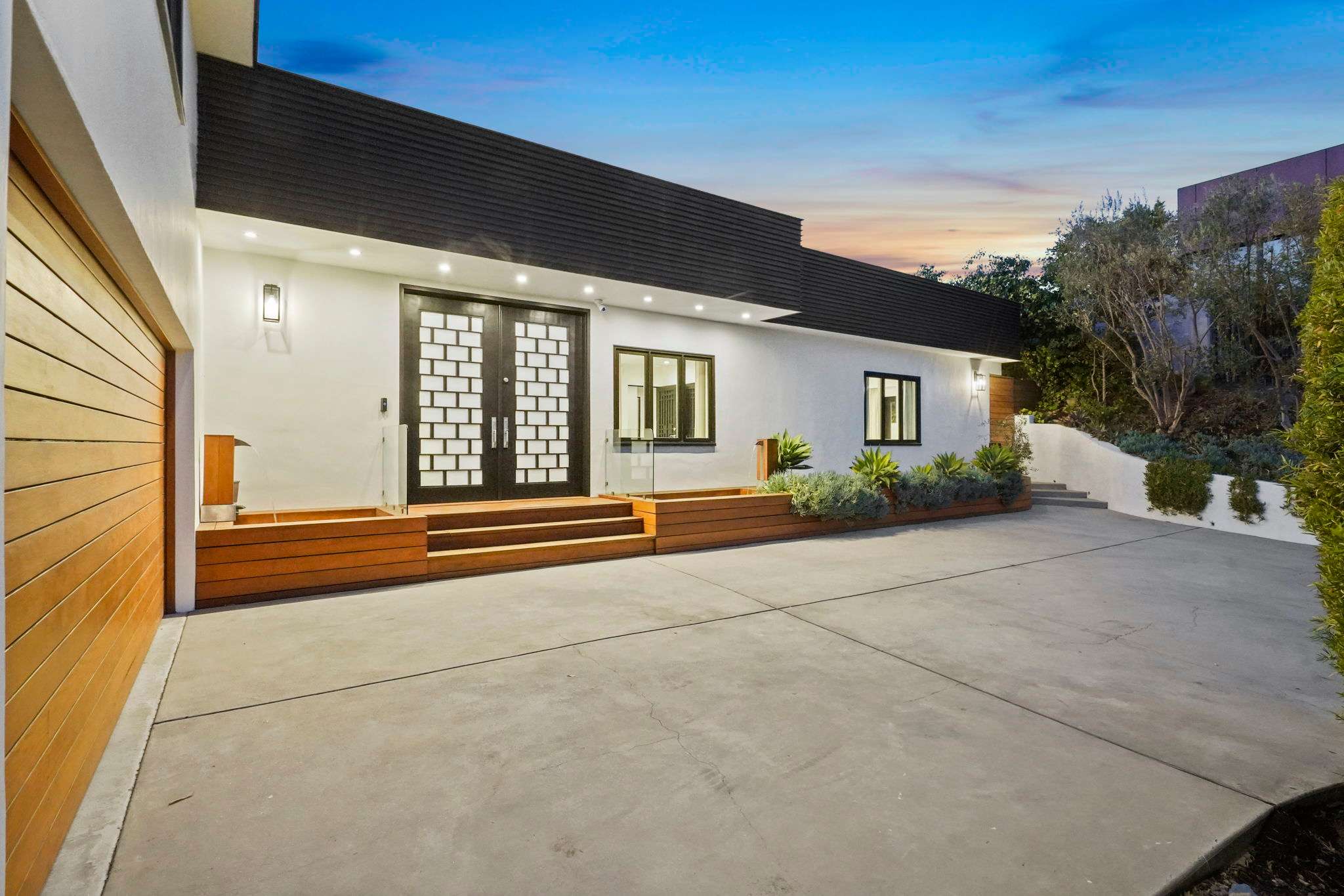 Private driveway and garage offer secure and seamless access.
