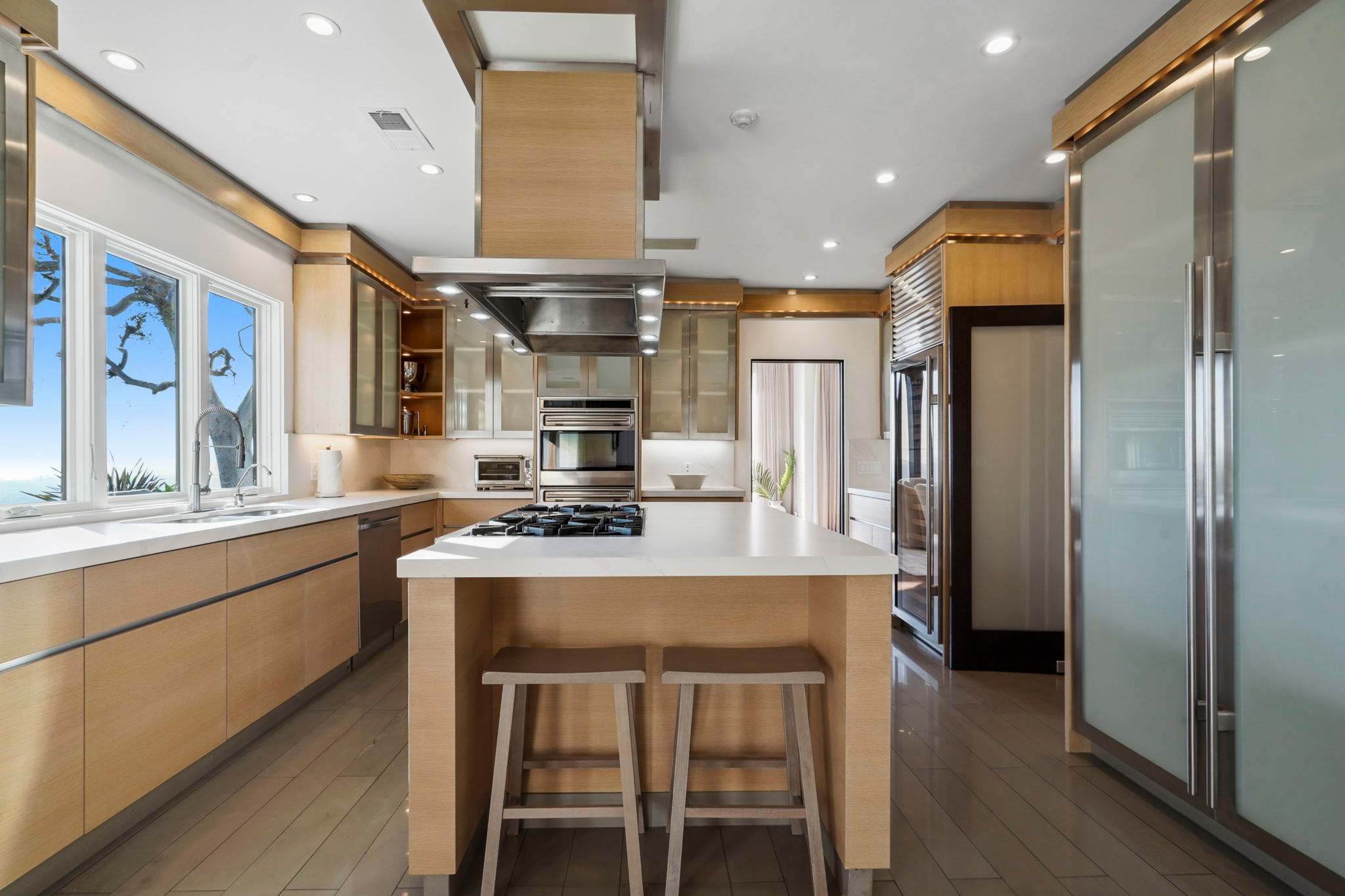 Natural light enhances every detail, from the backsplash to the fixtures.