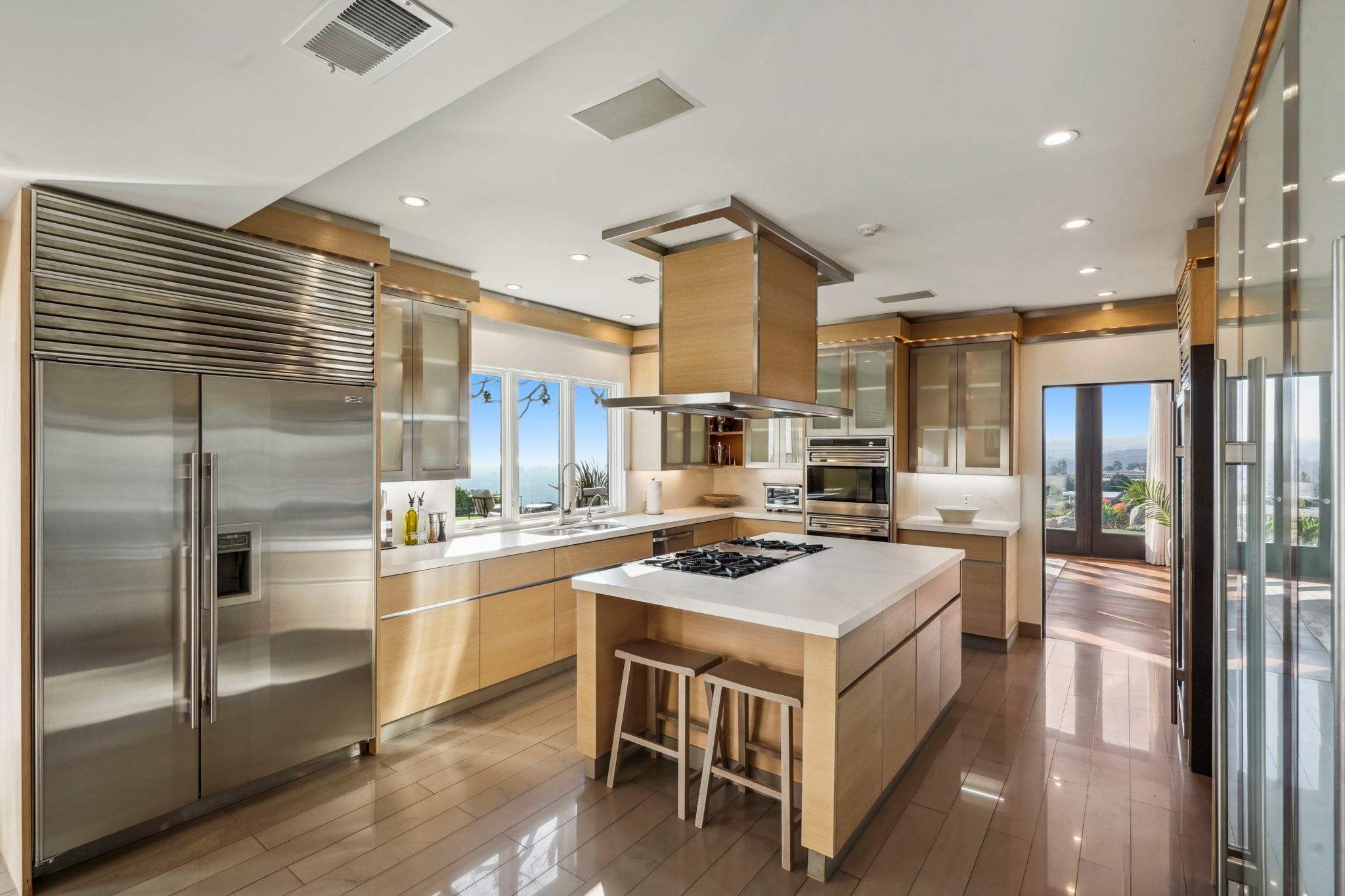 Enjoy the beauty of sleek cabinetry and polished stone countertops.