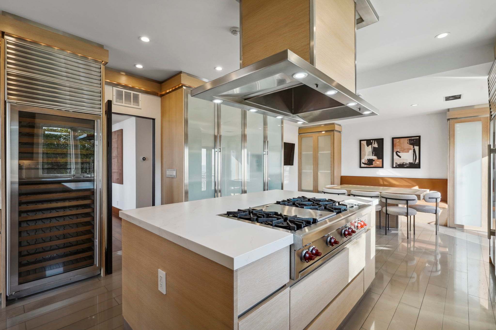 Discover a fully equipped kitchen with stainless steel appliances and ample counter space.