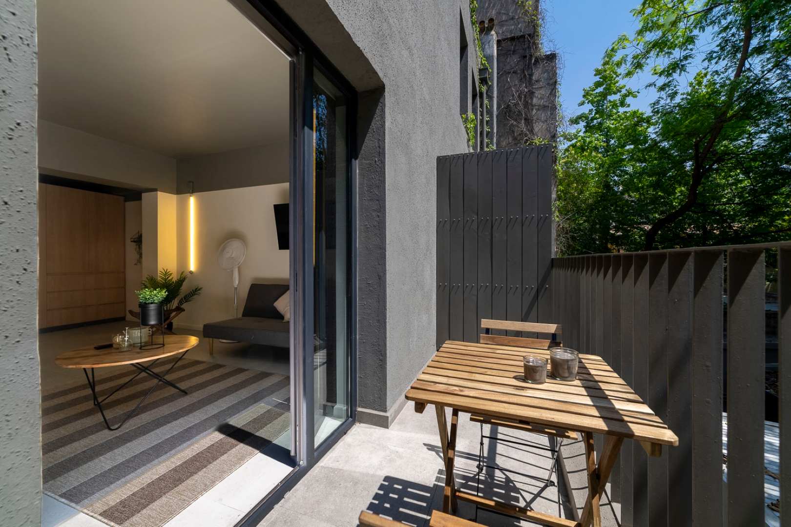 Relax on your private balcony with a view of lush greenery, perfect for morning coffee or evening relaxation.