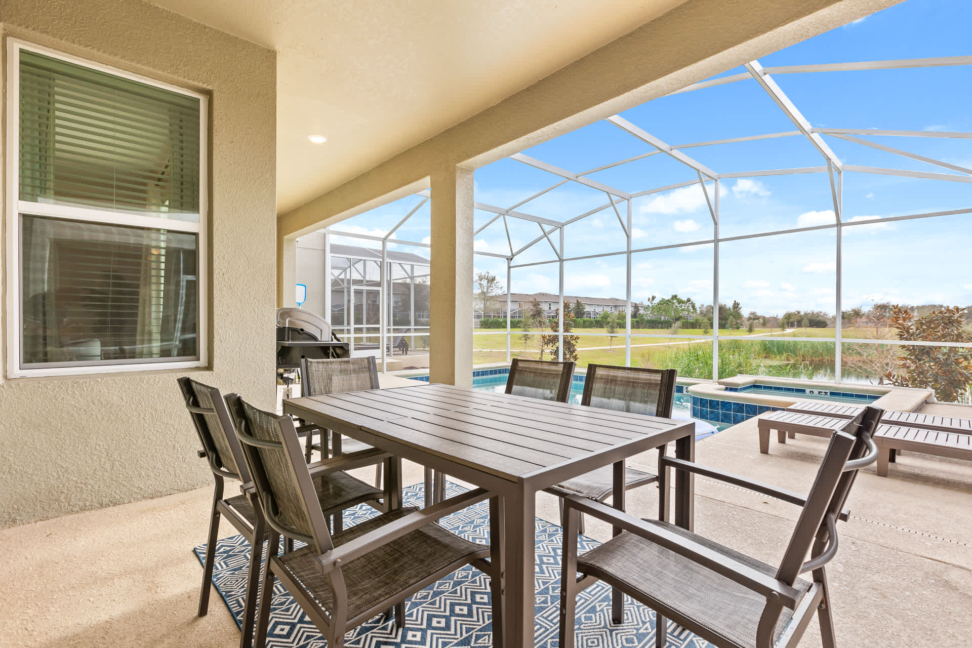 Covered Outdoor Poolside Dining Area with BBQ Grill