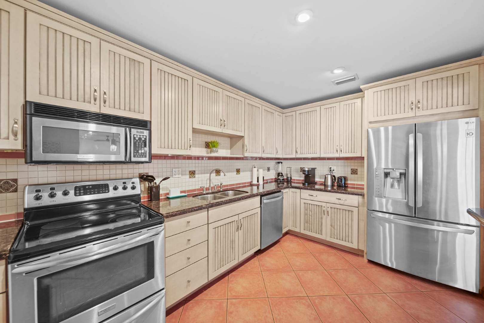 Cook up a storm in this spacious kitchen with modern appliances and ample storage, perfect for culinary adventures.