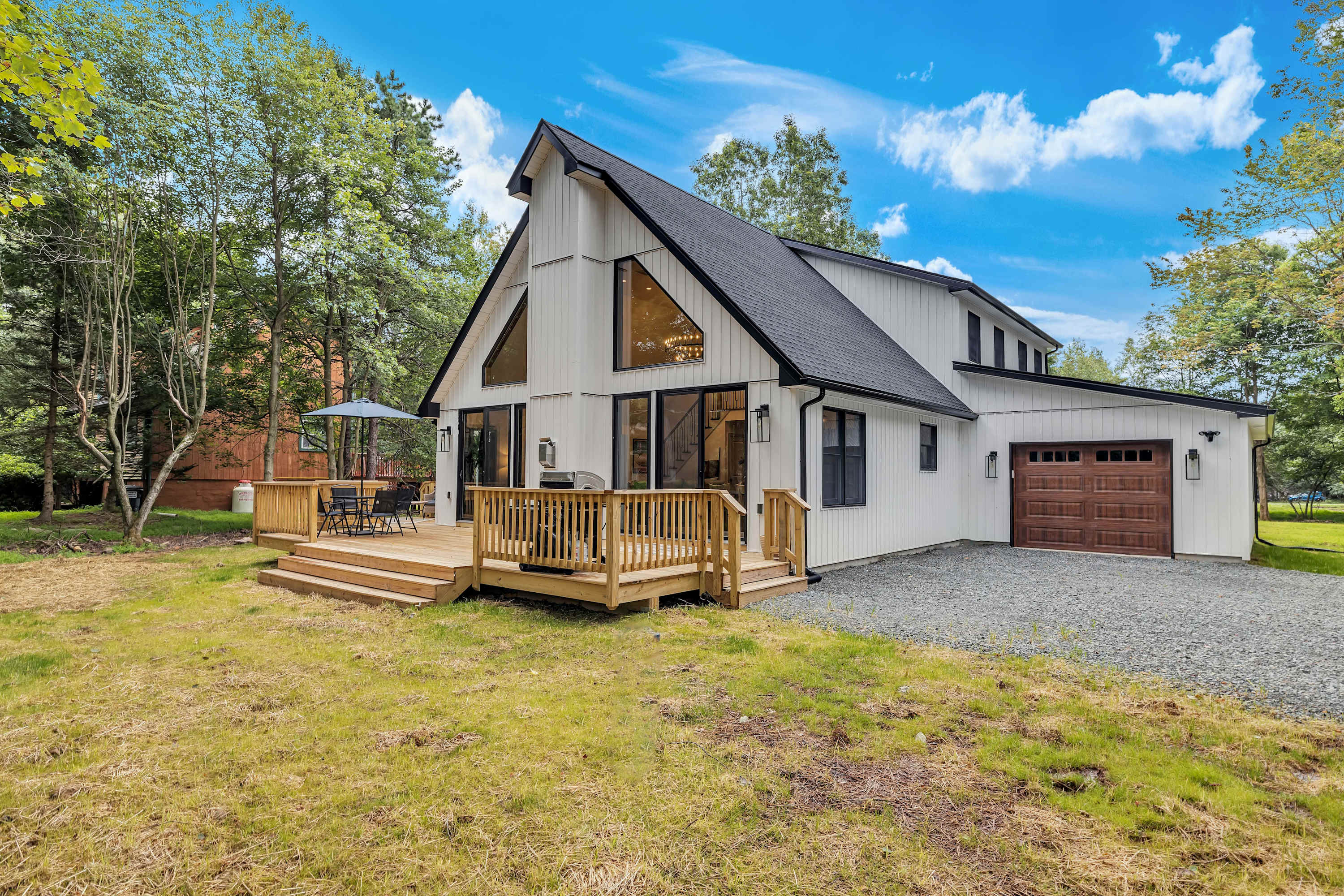 Charming A-Frame Getaway – A stunning modern A-frame cabin with a spacious deck, blending rustic charm with contemporary design for the perfect retreat.