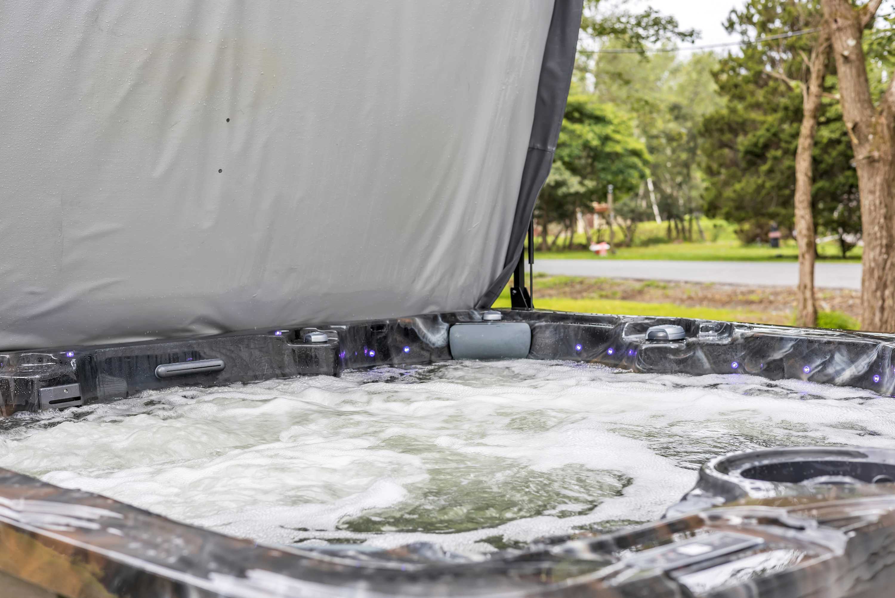 The Ultimate Hot Tub Escape – Sink into the soothing jets of this outdoor spa, surrounded by greenery for the perfect relaxation retreat.