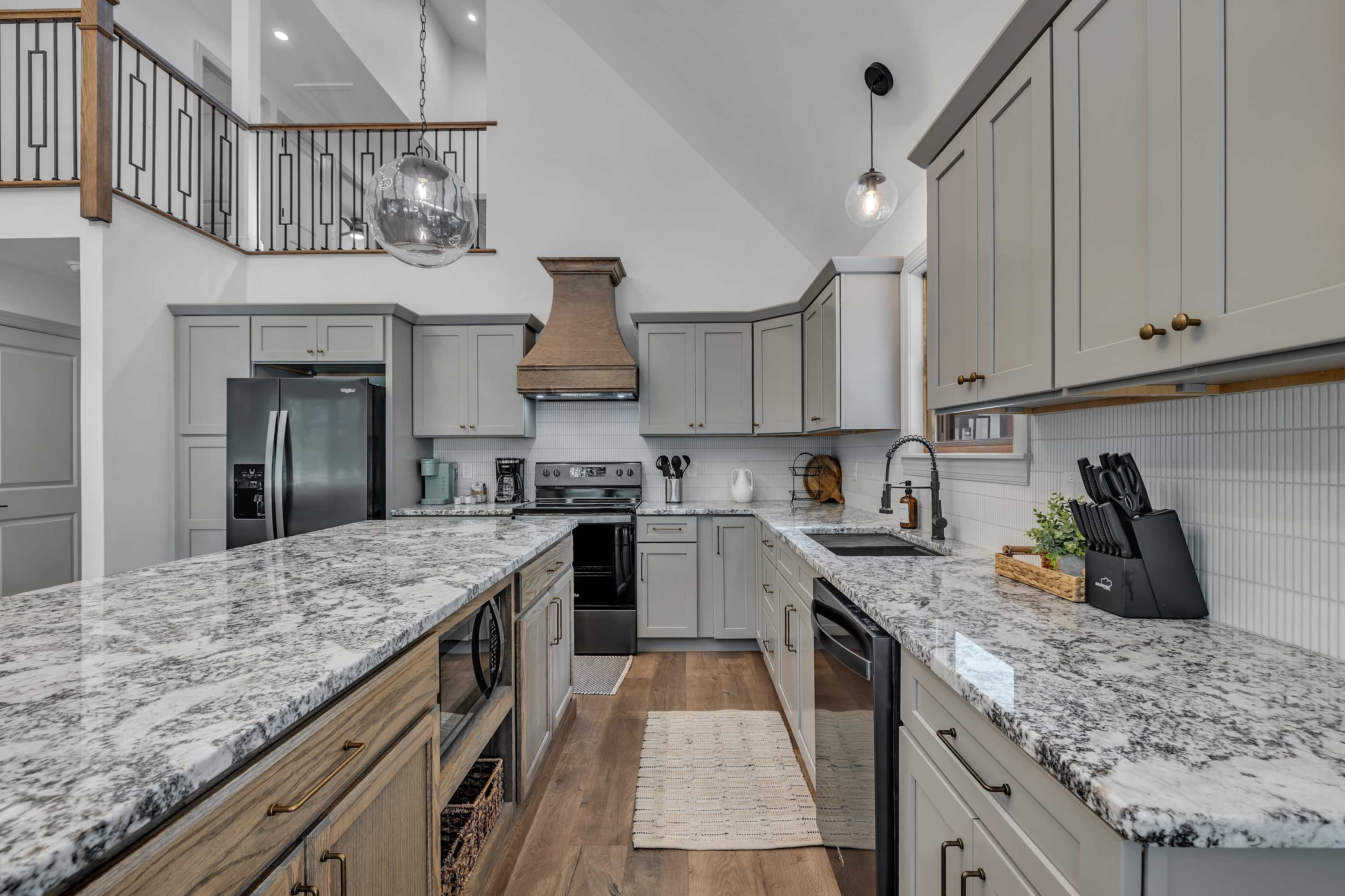 Sleek & Functional Kitchen Layout – Granite countertops, custom cabinetry, and stainless steel appliances make this kitchen a dream for any cooking enthusiast.