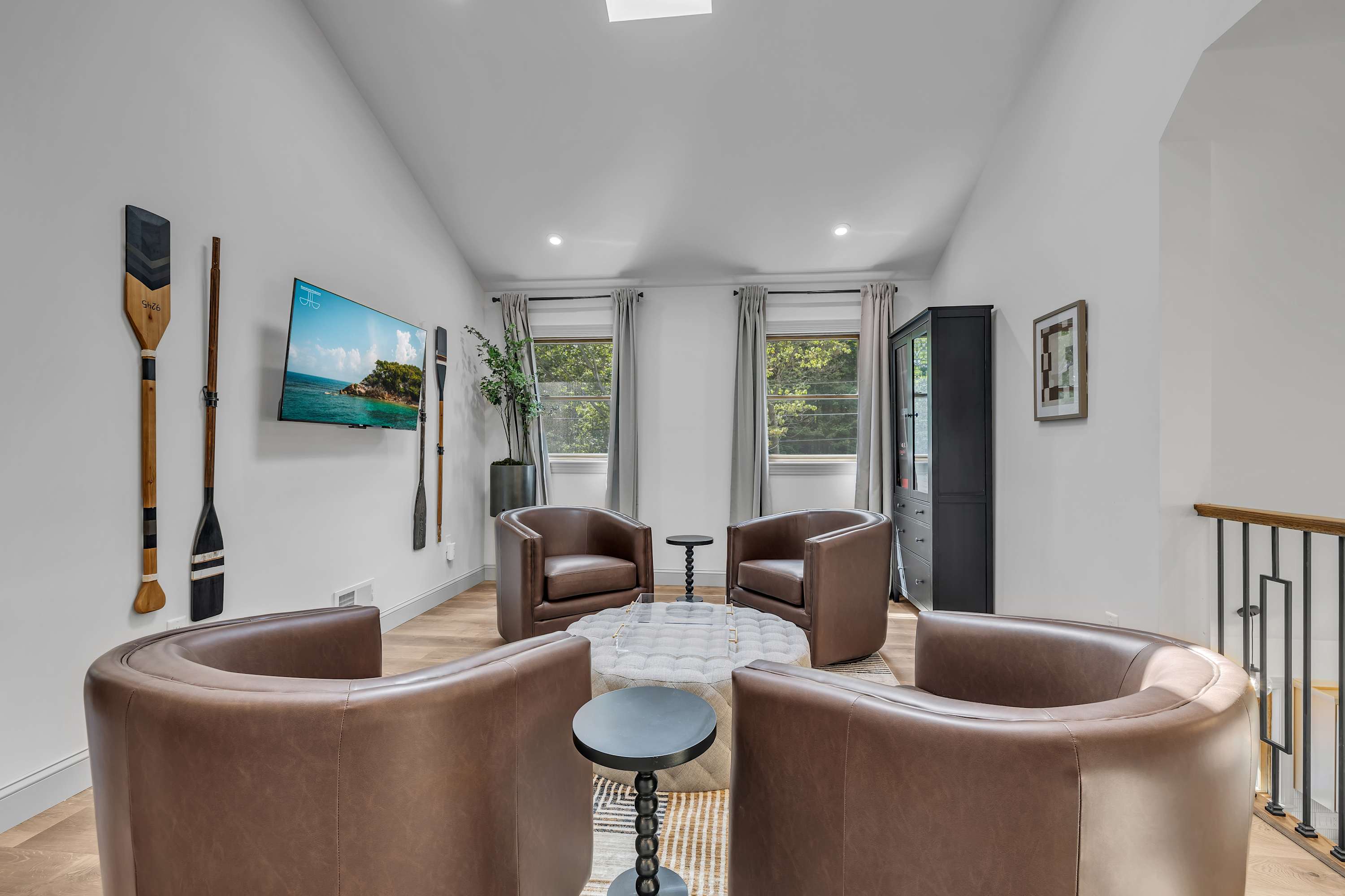 Chic Loft Lounge Area – A stylish open-concept loft with cozy seating, high ceilings, and large windows that flood the space with natural light.