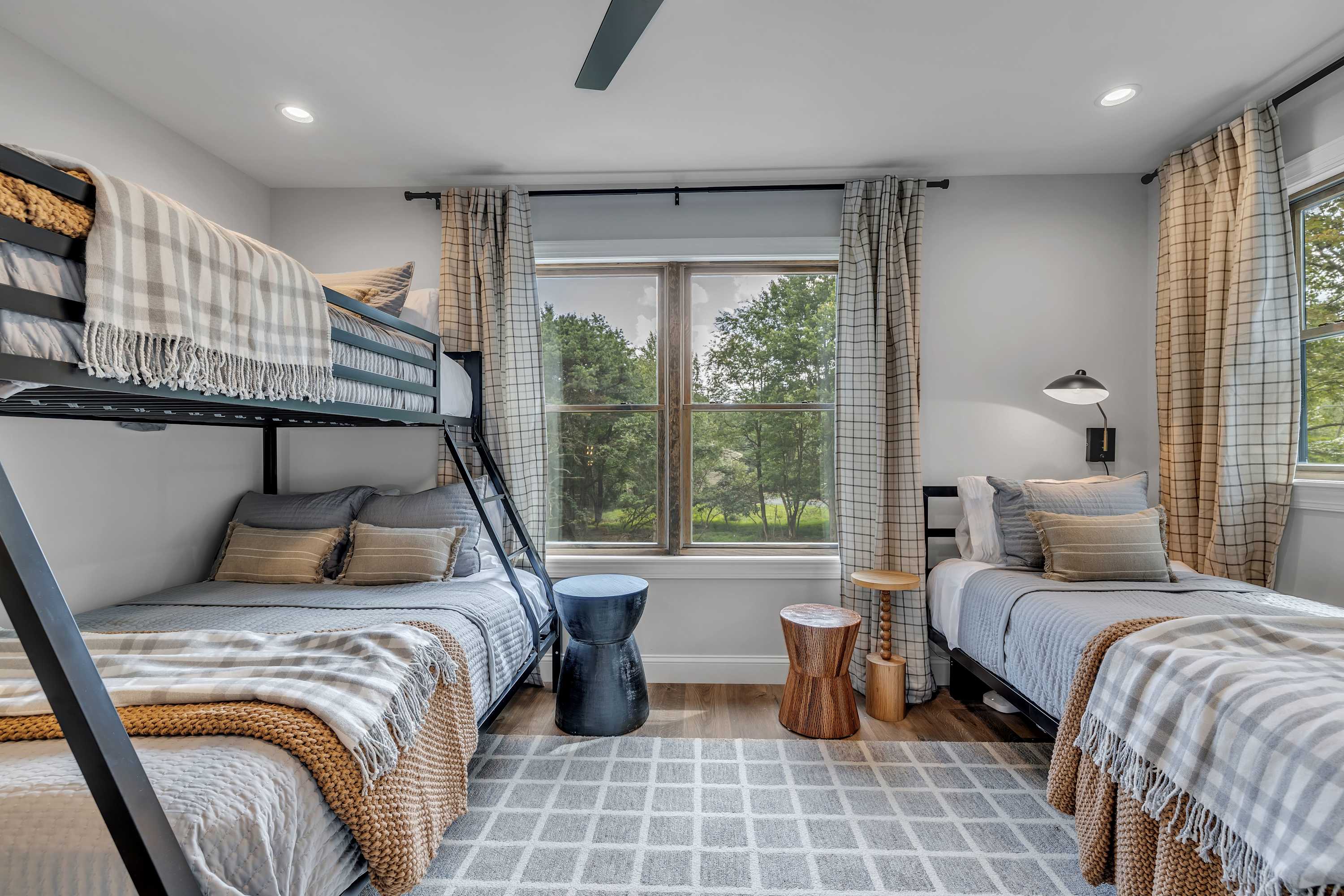 The Ultimate Kid & Group-Friendly Room – This cozy yet modern bedroom offers a stylish bunk bed setup, soft lighting, and scenic outdoor views.