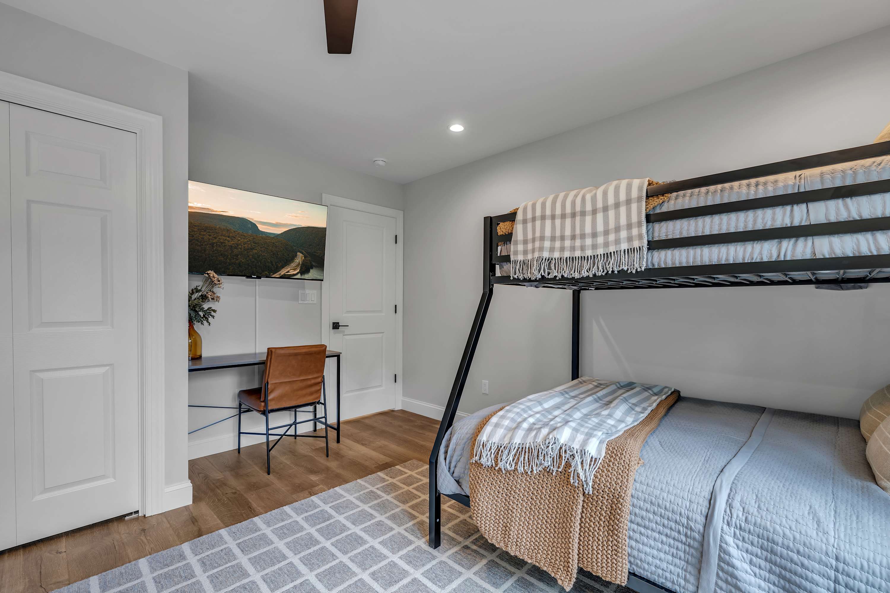 Inviting & Practical Bedroom Setup – A well-organized sleeping space with a built-in desk, ideal for both relaxation and productivity.
