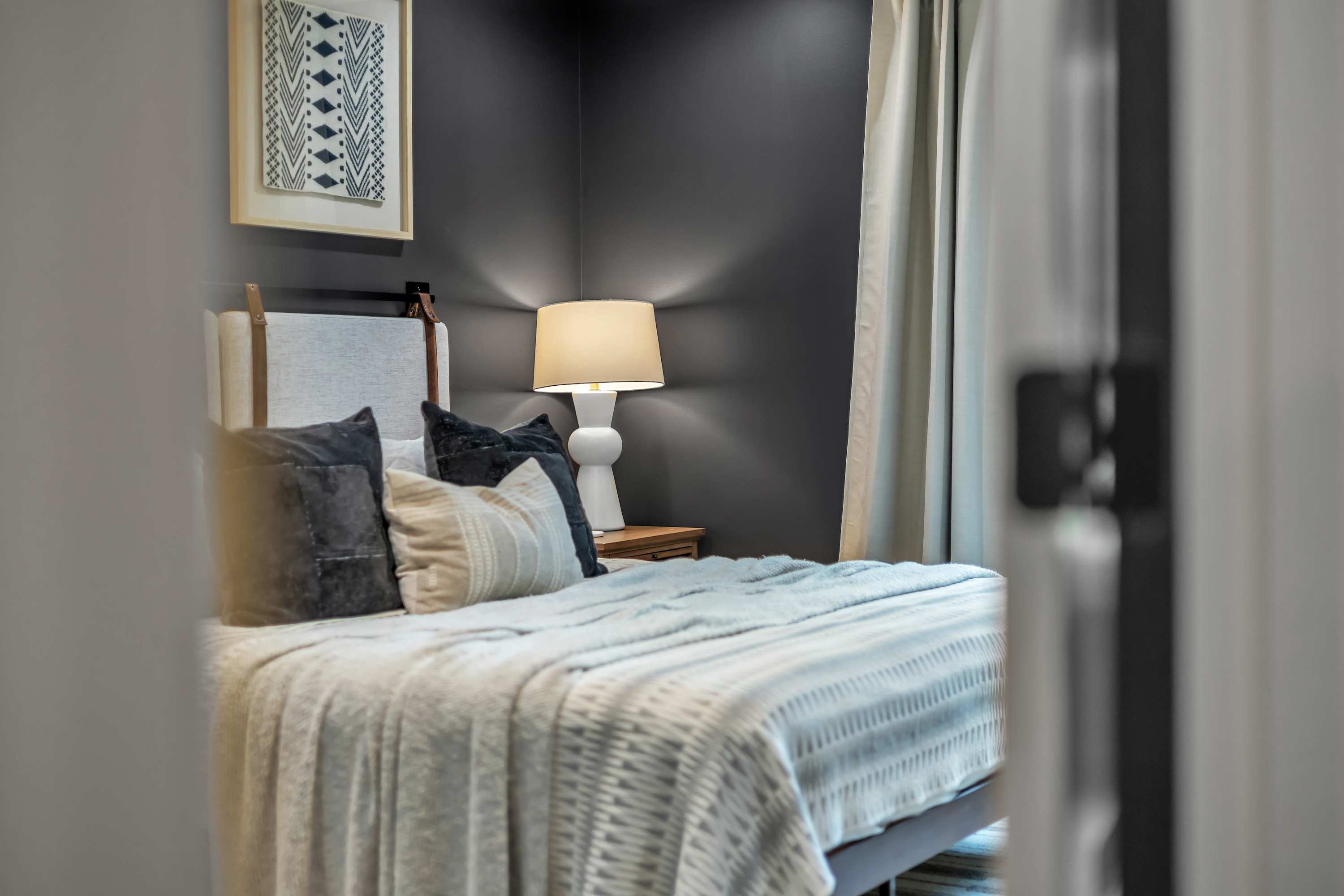Tranquil Bedroom Escape – A cozy and stylish bedroom featuring soft lighting, plush bedding, and modern decor, creating the perfect atmosphere for restful nights.