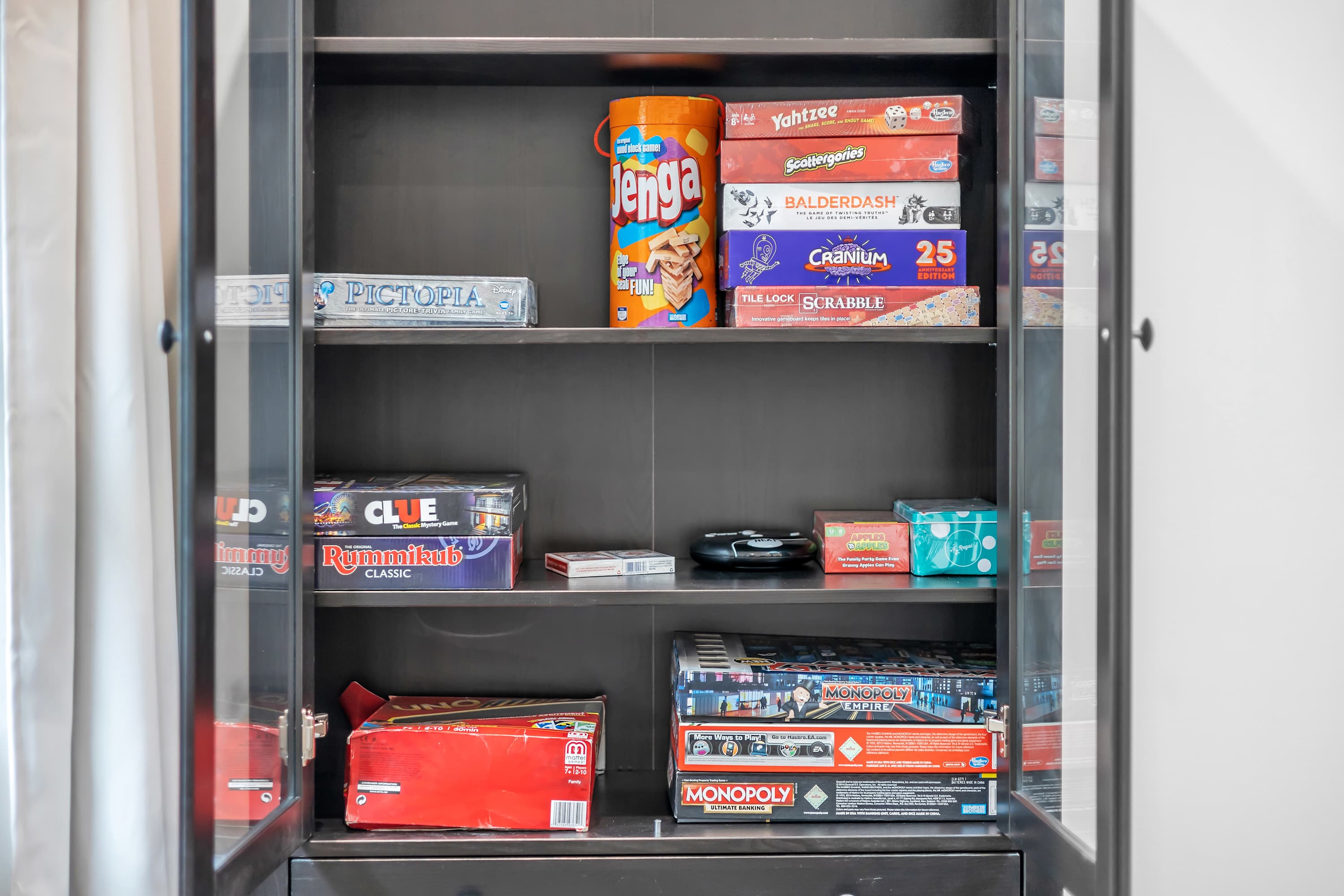 Board Game Collection for All Ages – A fully stocked game shelf with classic board games, ensuring entertainment for every guest.