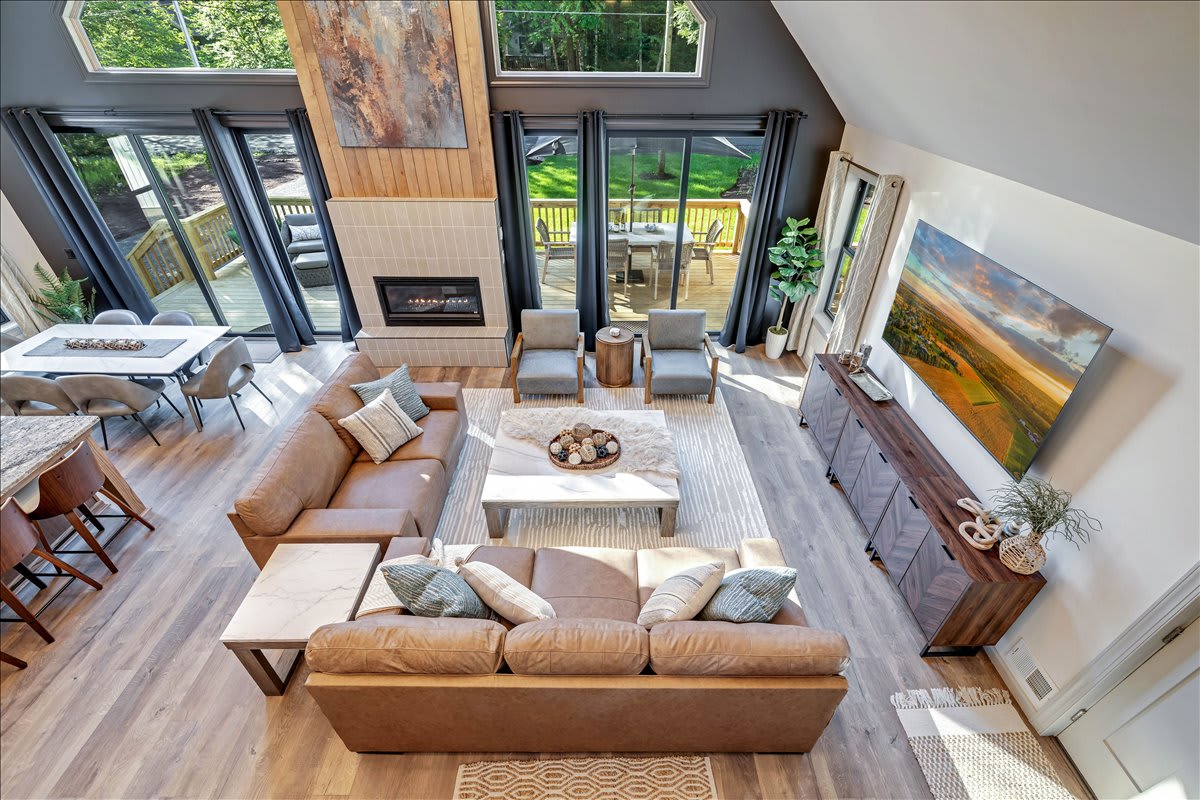 Stay cozy year-round in this stylish and naturally-lit living area.