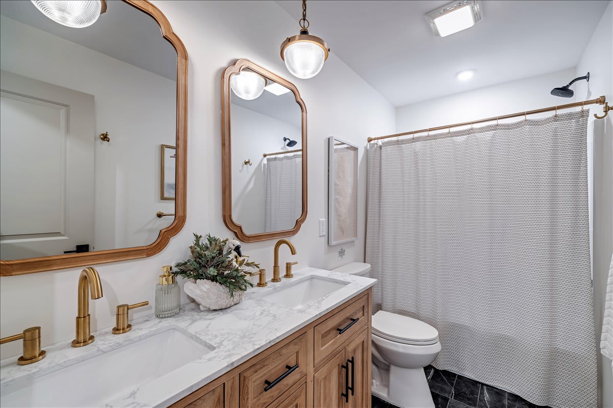 Start your day refreshed in this bright, clean bathroom.