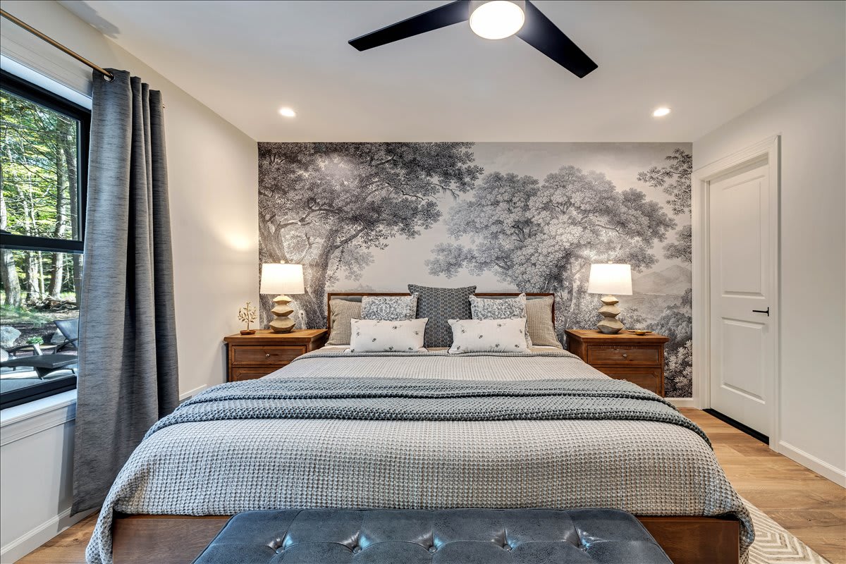 Wake up refreshed in the king bed of this calming and beautifully decorated bedroom.