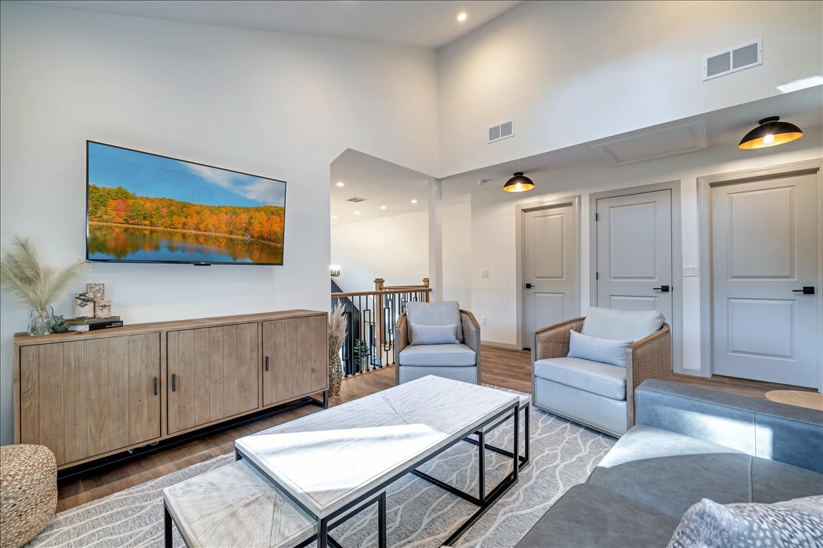 The elegant loft provides another comfortable space to gather with friends and family