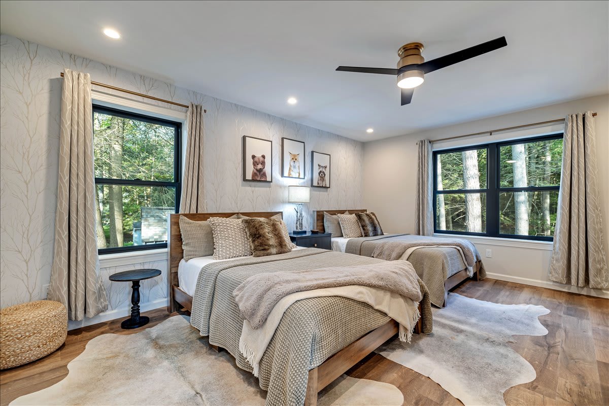 Bedroom 3 with two double beds - Wishing you sweet dreams in this warm and inviting bedroom.