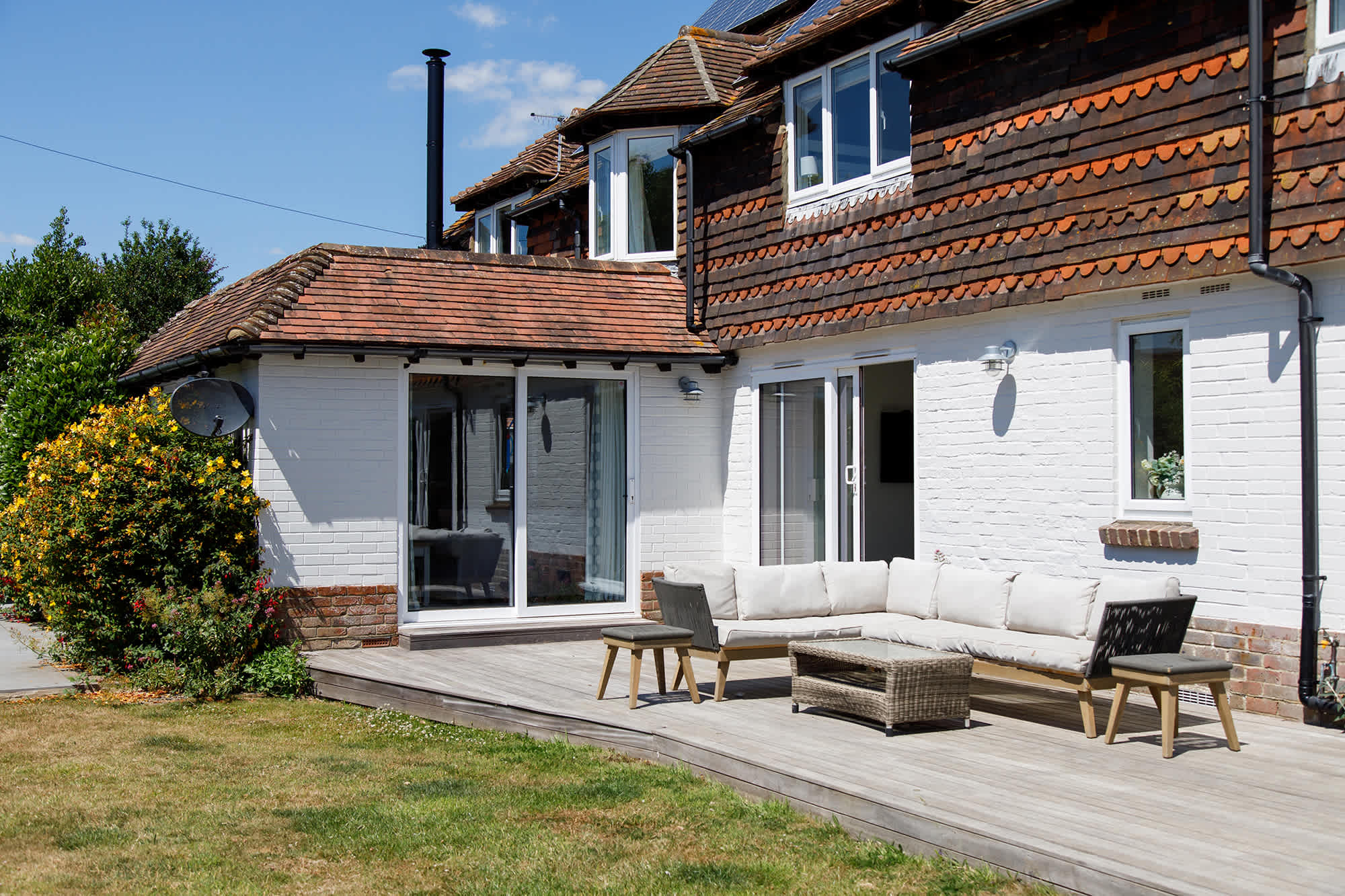 The outside seating on the decking is off the kitchen and a lovely spot to soak up the sun.