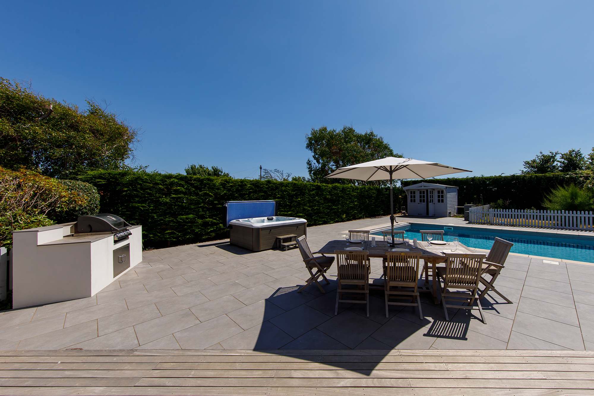 The outside space certainly has the wow factor, with in-built gas BBQ, multiple seating areas, hot tub and pool.