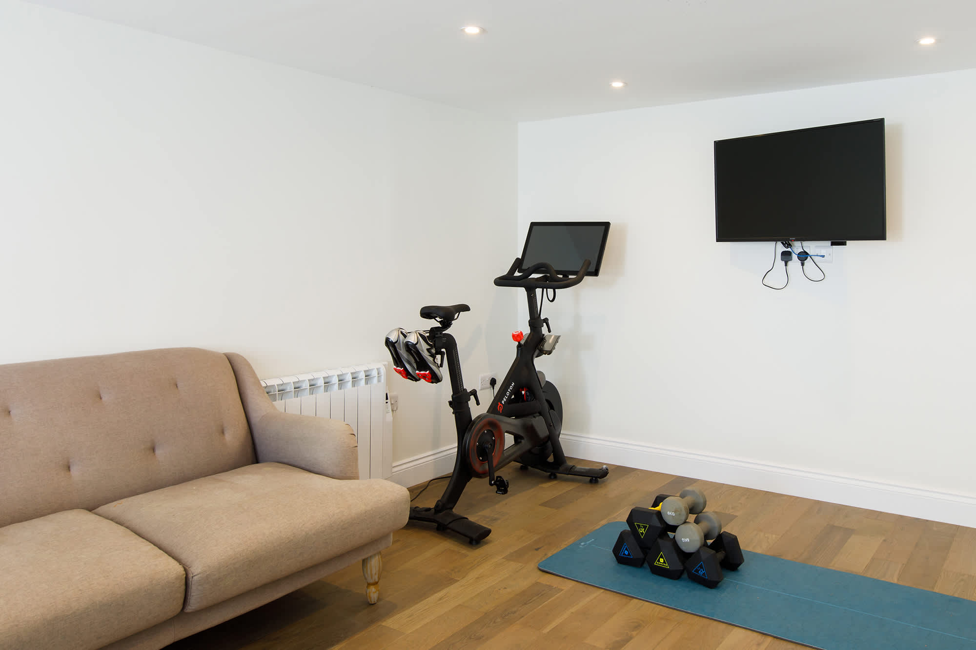The games room also has a mini gym, with yoga mat, weights and Pelaton bike!