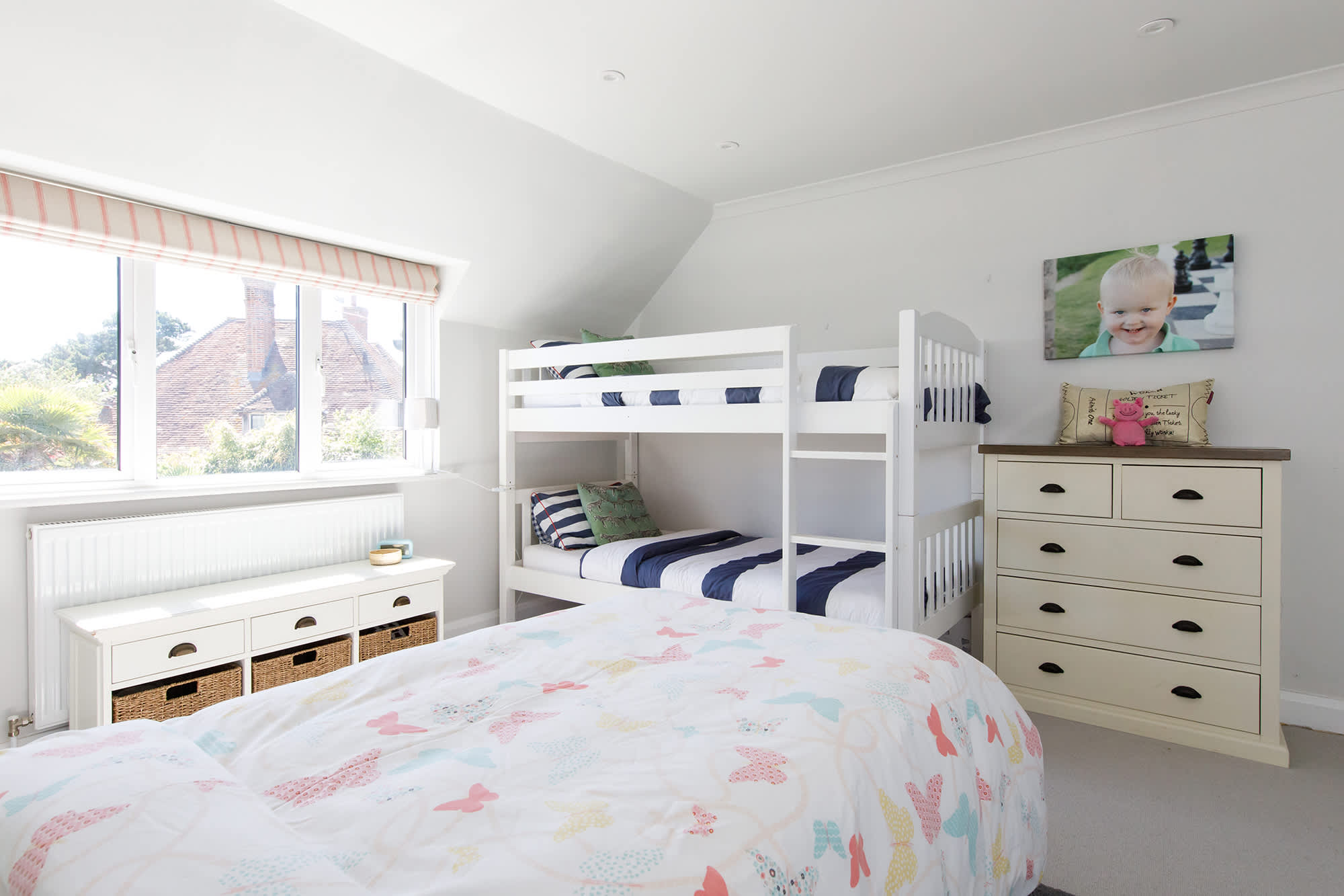 The room can sleep up to 4, with a trundle bed as well as bunks.