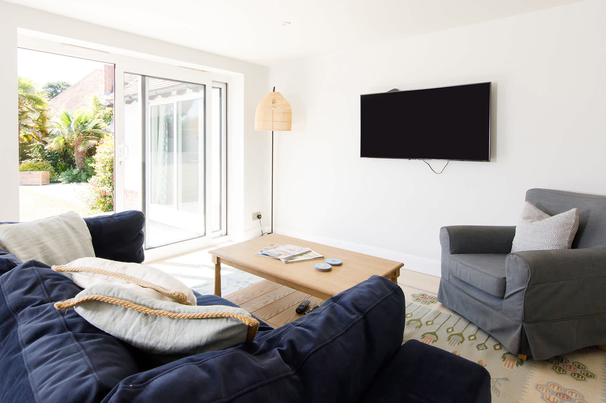 The snug lounge that connects to the kitchen is the perfect place to take the weight off with a cup of tea and a good book.