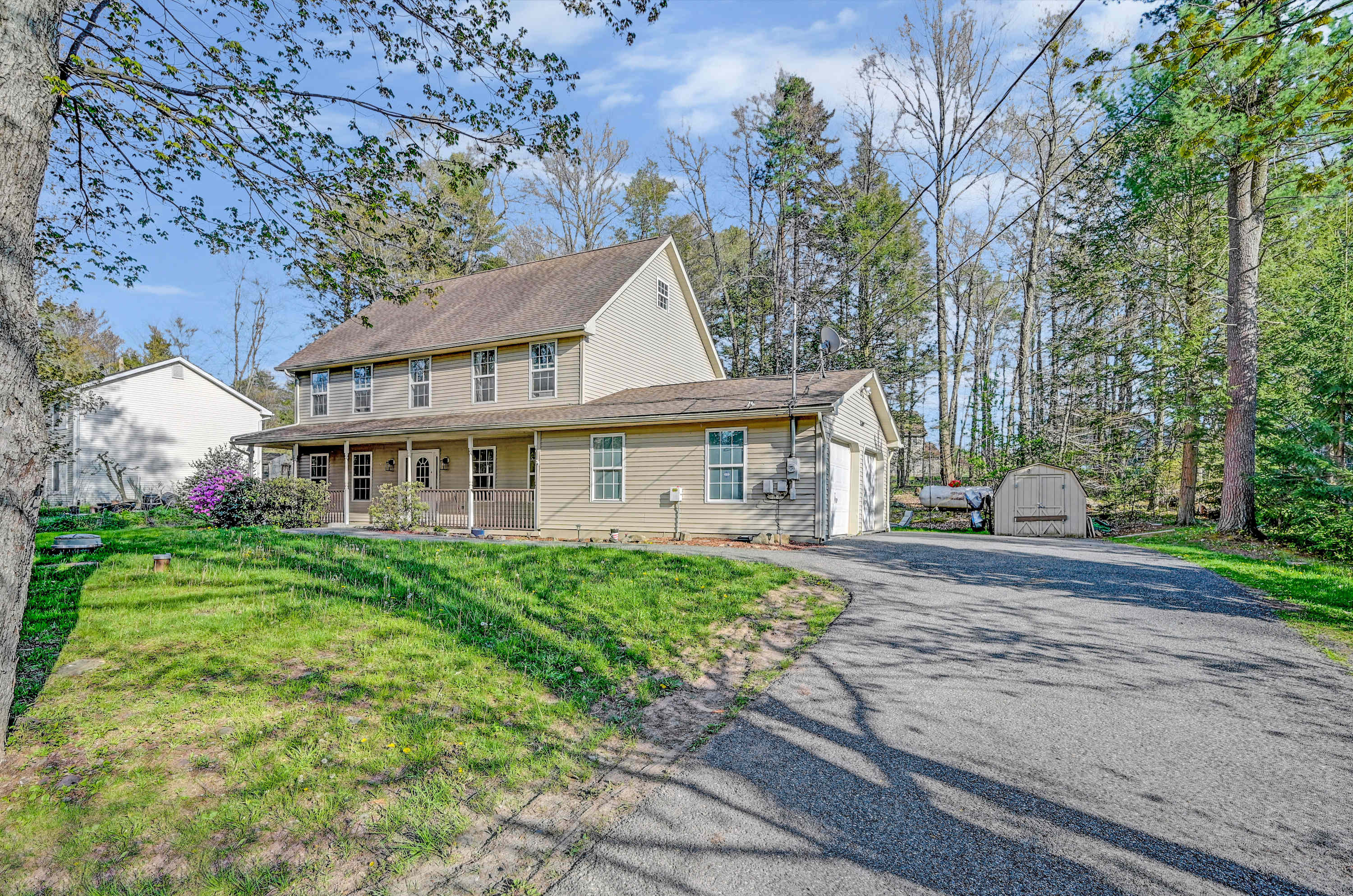 Your Vacation Starts Here! A peaceful and inviting home with a long driveway, plenty of space, and a touch of nature.