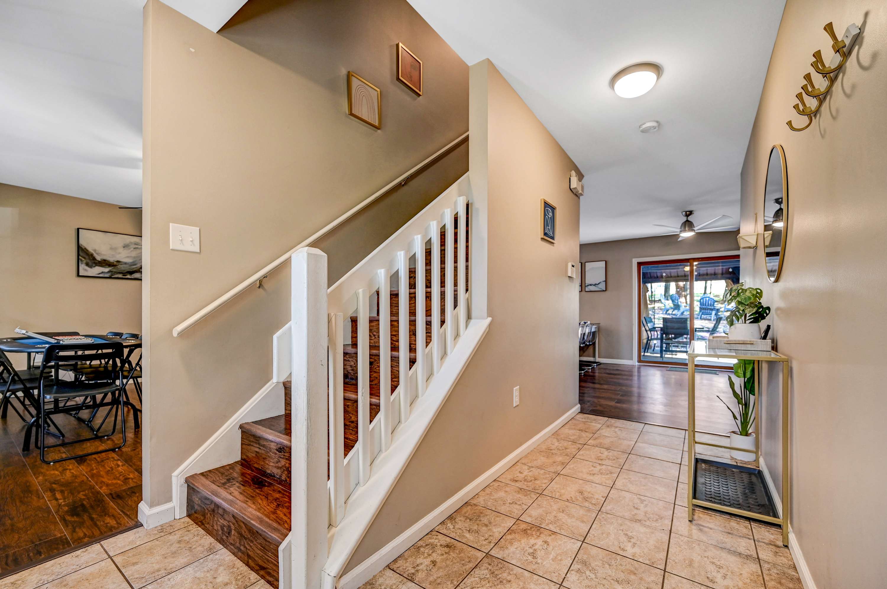 Welcoming First Impression! This stylish and functional entryway provides the perfect start to your stay, organized, bright, and inviting!