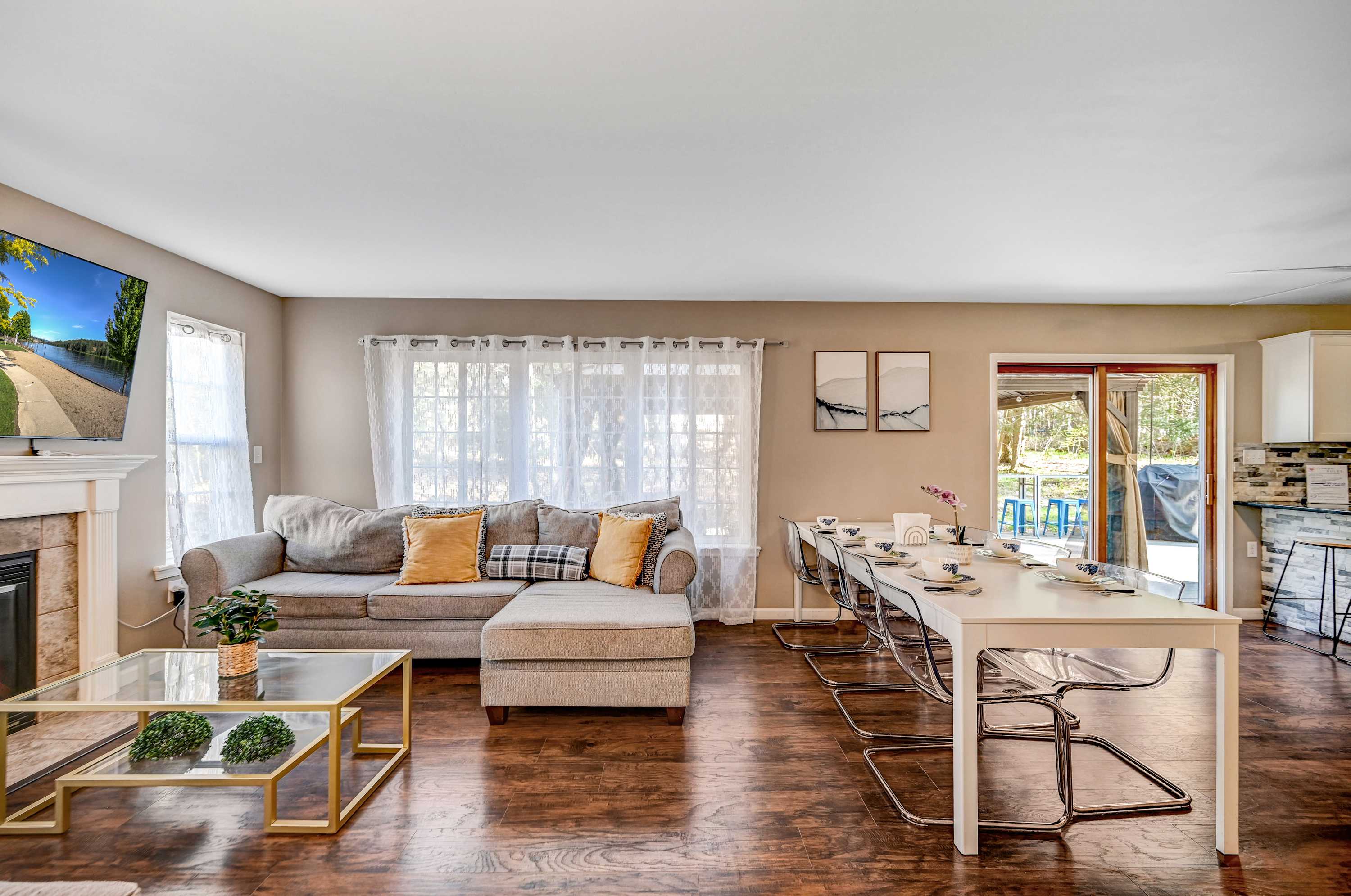 Unwind in Style! Enjoy a movie by the fireplace or share a meal at the sleek dining table in this thoughtfully designed and welcoming living space.