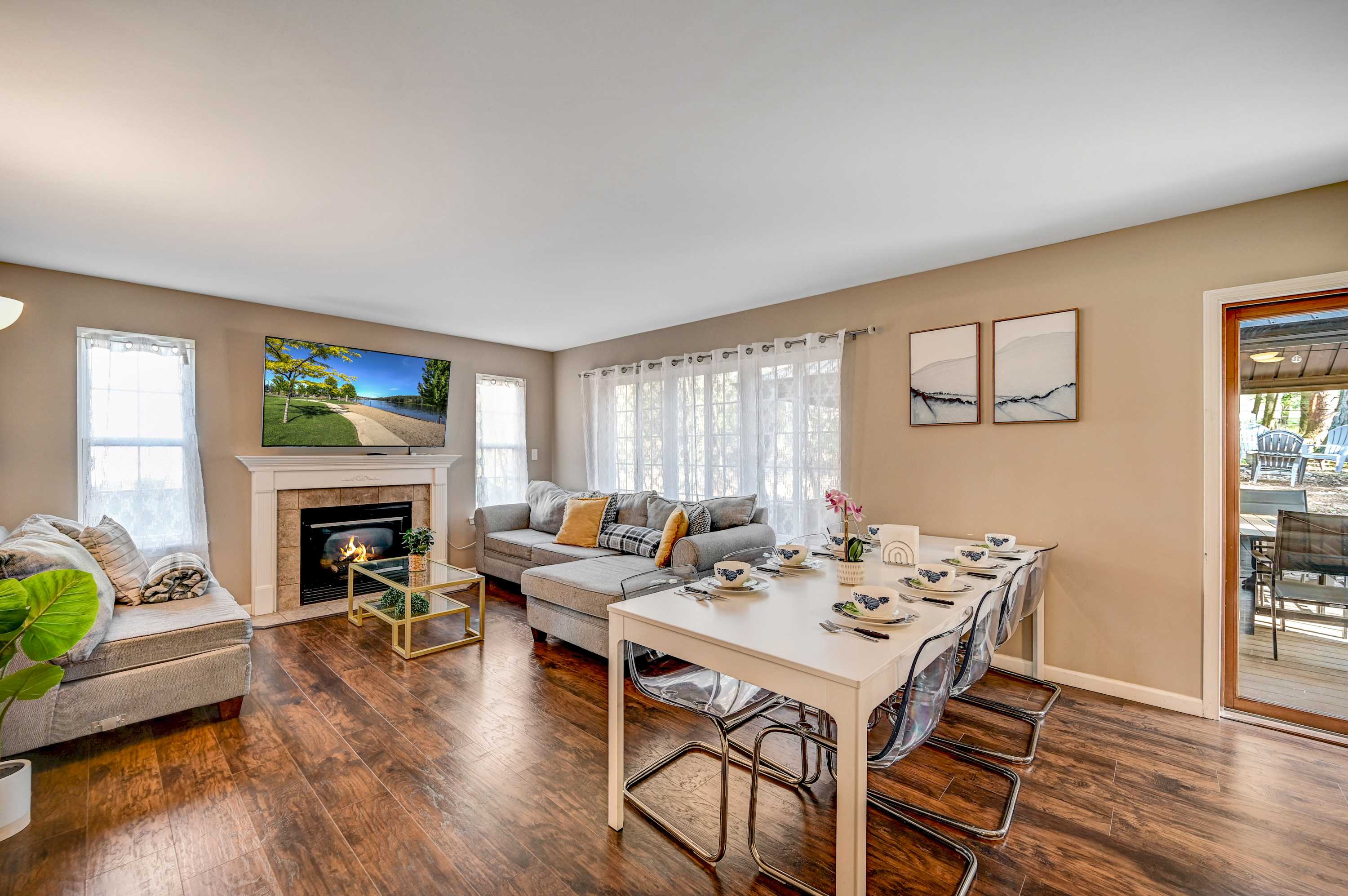 Perfect for Relaxation! A bright and airy living room with cozy seating, a stunning fireplace, and a large TV, ideal for movie nights or casual conversations.