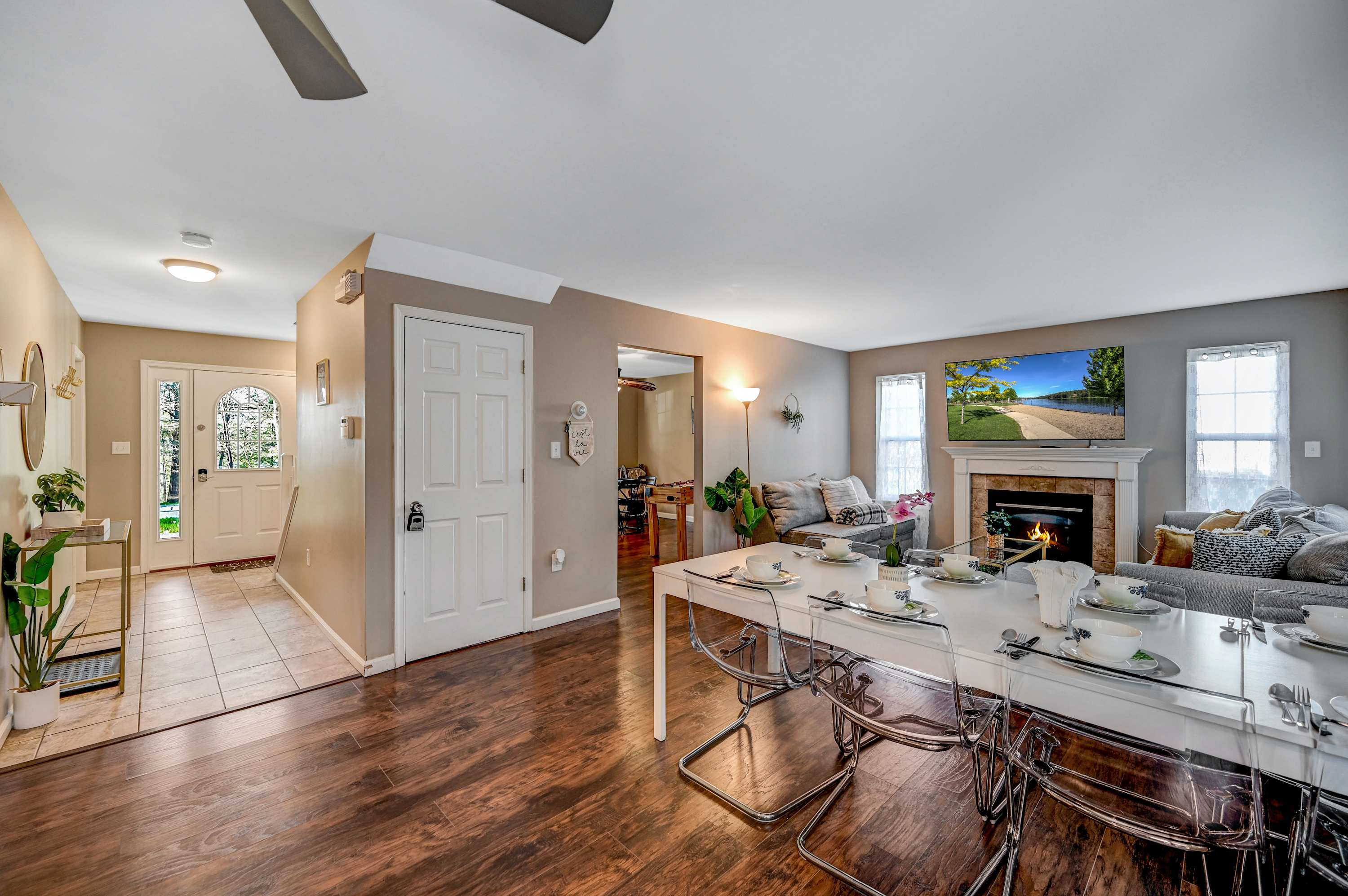 A Home Away from Home! This thoughtfully arranged space offers a welcoming atmosphere with a fireplace, cozy seating, and a dining table ready for memorable meals.