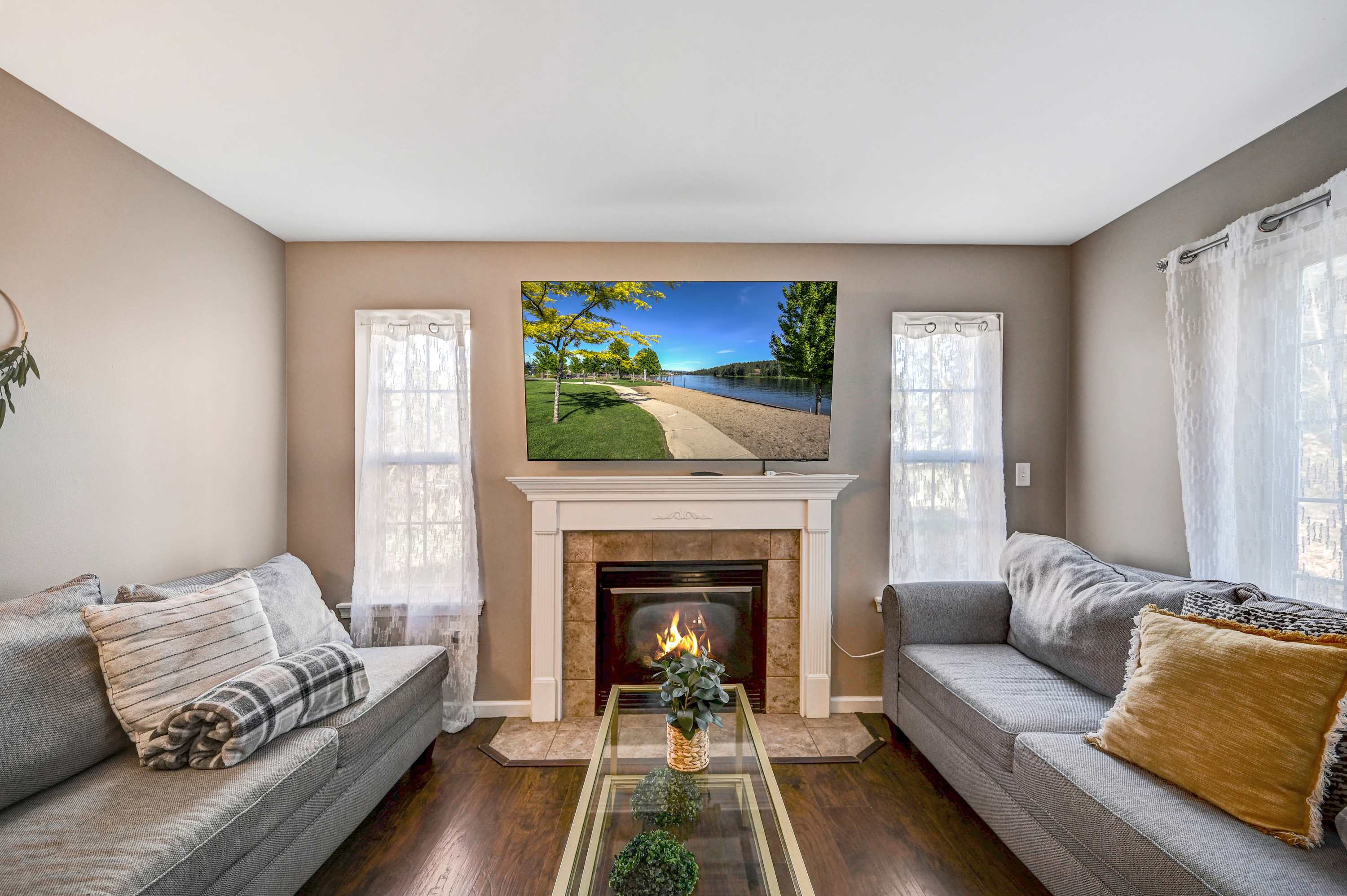 Relax & Unwind! Sink into plush sofas and enjoy the warmth of the fireplace while watching your favorite shows on the large TV.