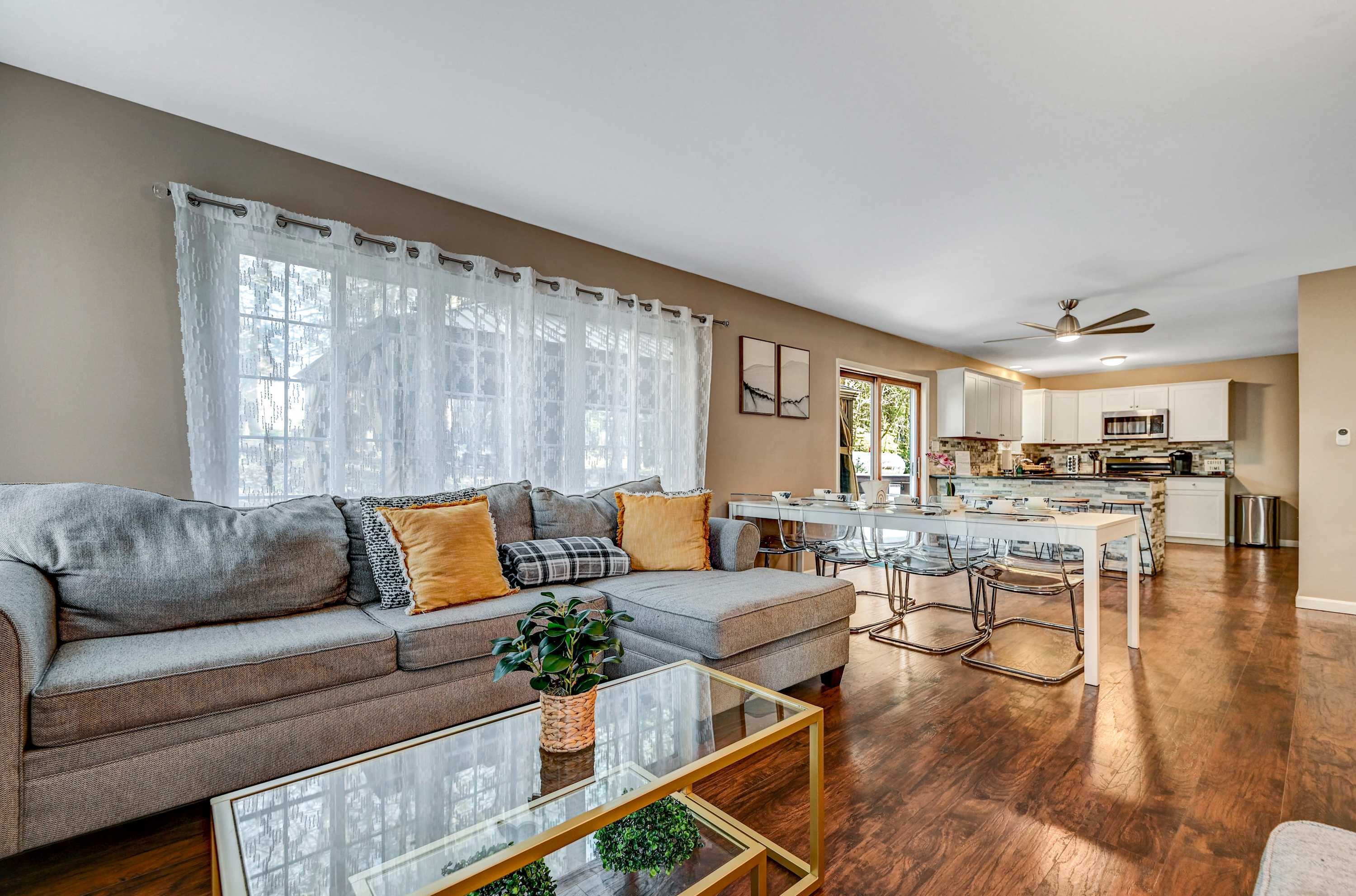 Spacious & Inviting! A warm and modern living area that flows into the kitchen, ideal for quality time and shared meals.