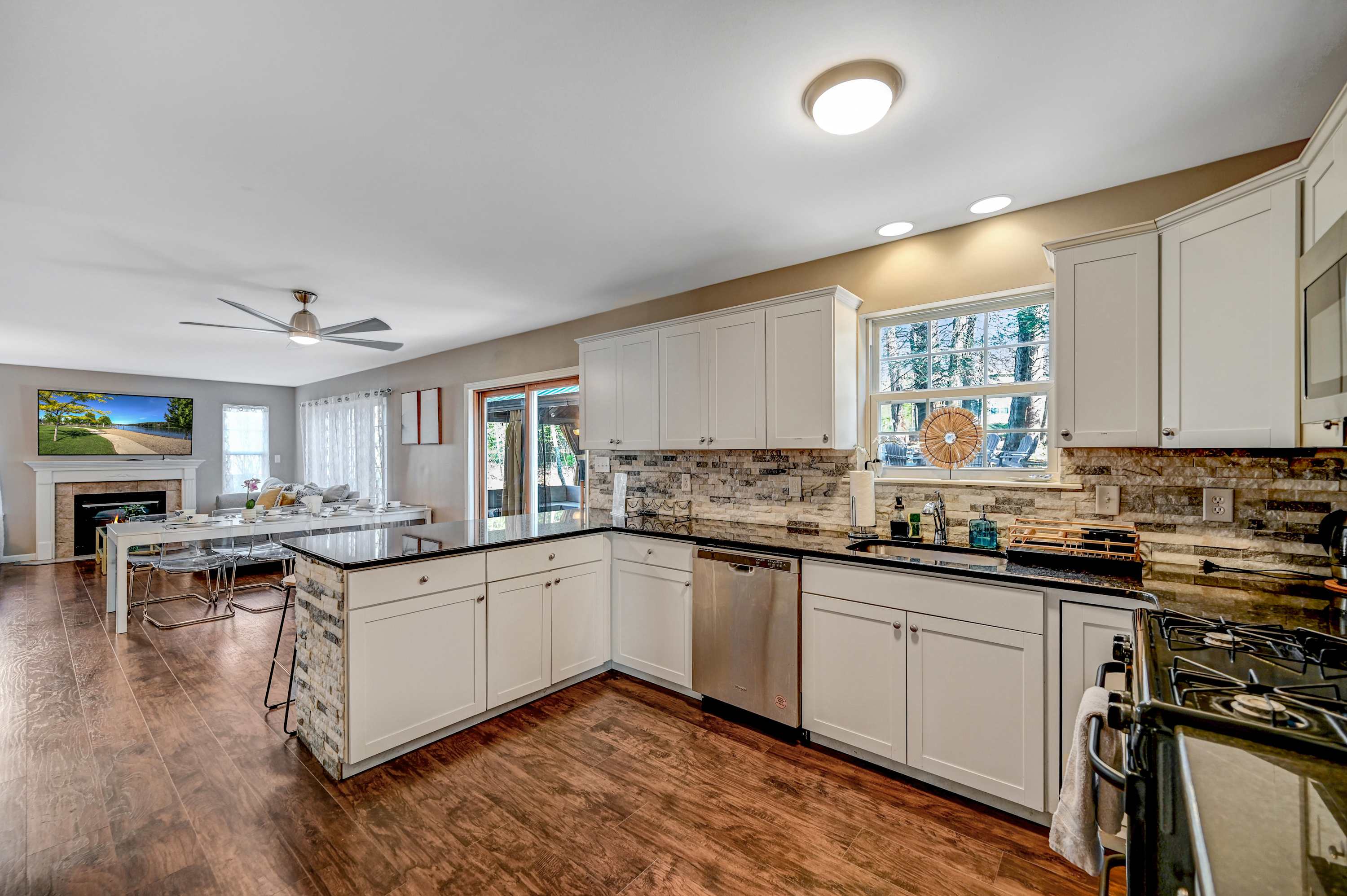 Spacious, Bright & Perfectly Designed! With ample counter space, sleek stainless steel appliances, and a view into the cozy living room, this kitchen is as functional as it is stylish.