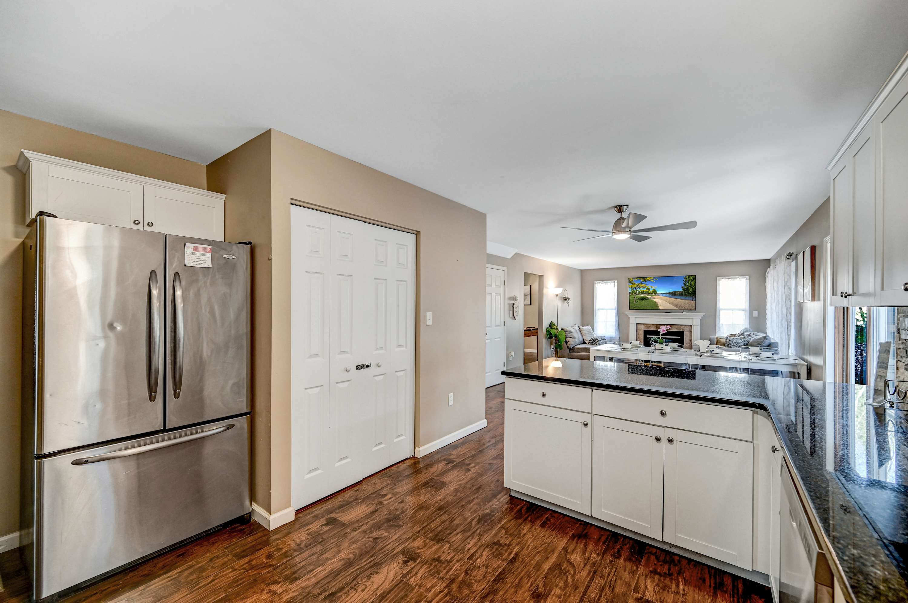 Effortless Flow, Inviting Charm! This open-concept kitchen seamlessly connects to the living area, making it easy to cook, chat, and unwind, all in one beautiful space. 